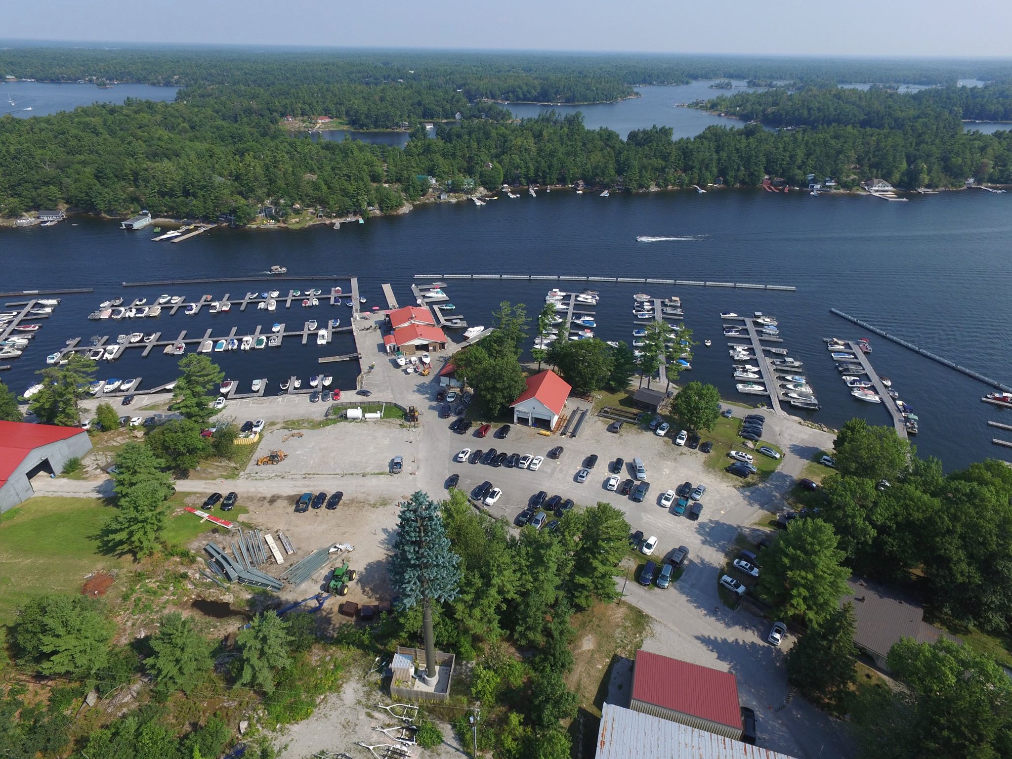 Nautilus Marina; an expansive marina on calm blue waters surrounded by lushly forested shores and islands. 