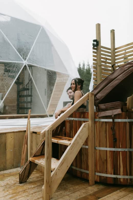 Glamping domes and wood-fired hot tubs at Sunnd Eco Resort.