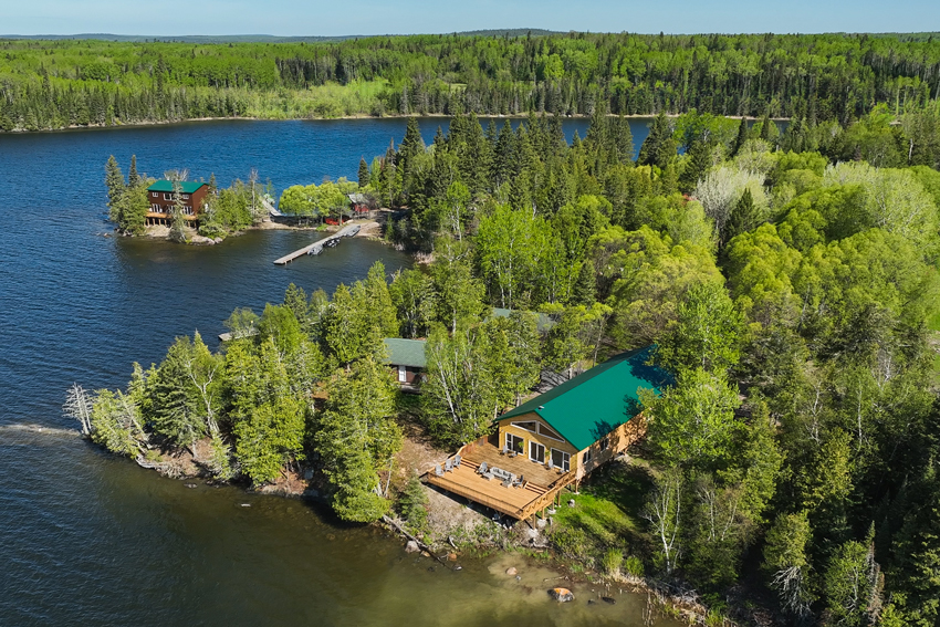 aerial of nordic pine lodge on perrault lake, sunset country