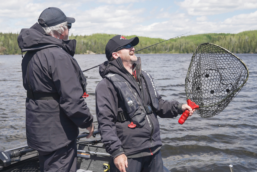 broken net anglers fishing from a boat