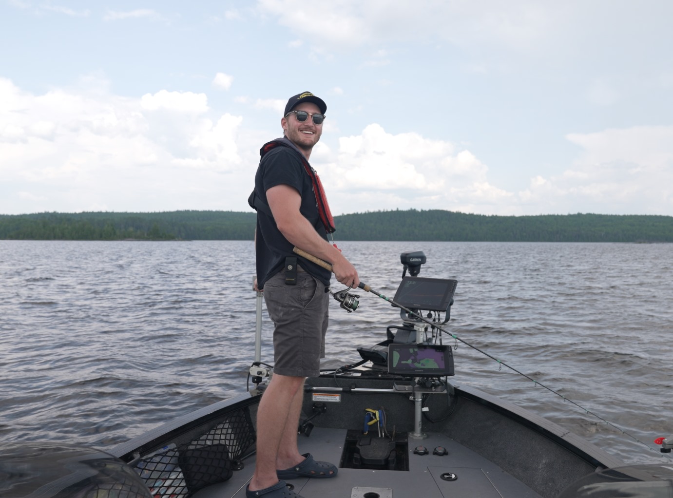 angler standing in boat fishing