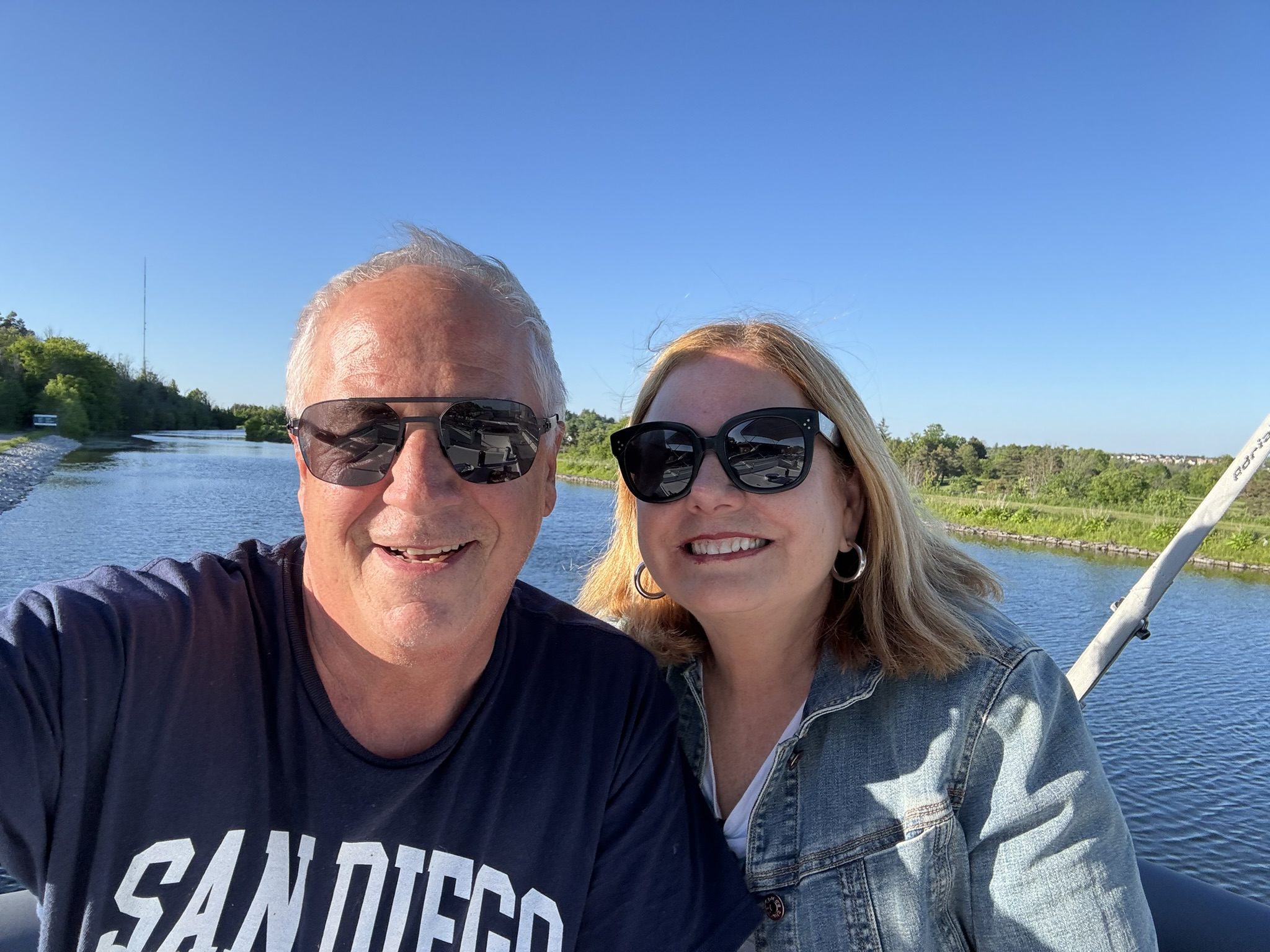 A couple boating on the Trent Severn Waterway in Ontario Canada.