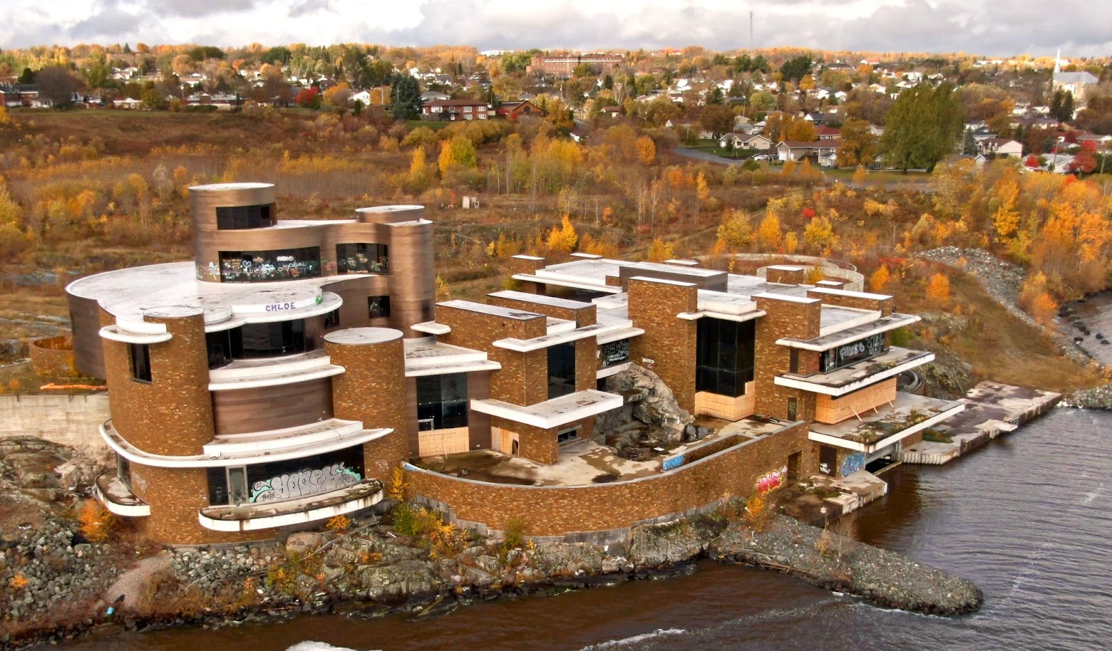 A giant, modern mansion with unusual swooping, curved architecture and towers.