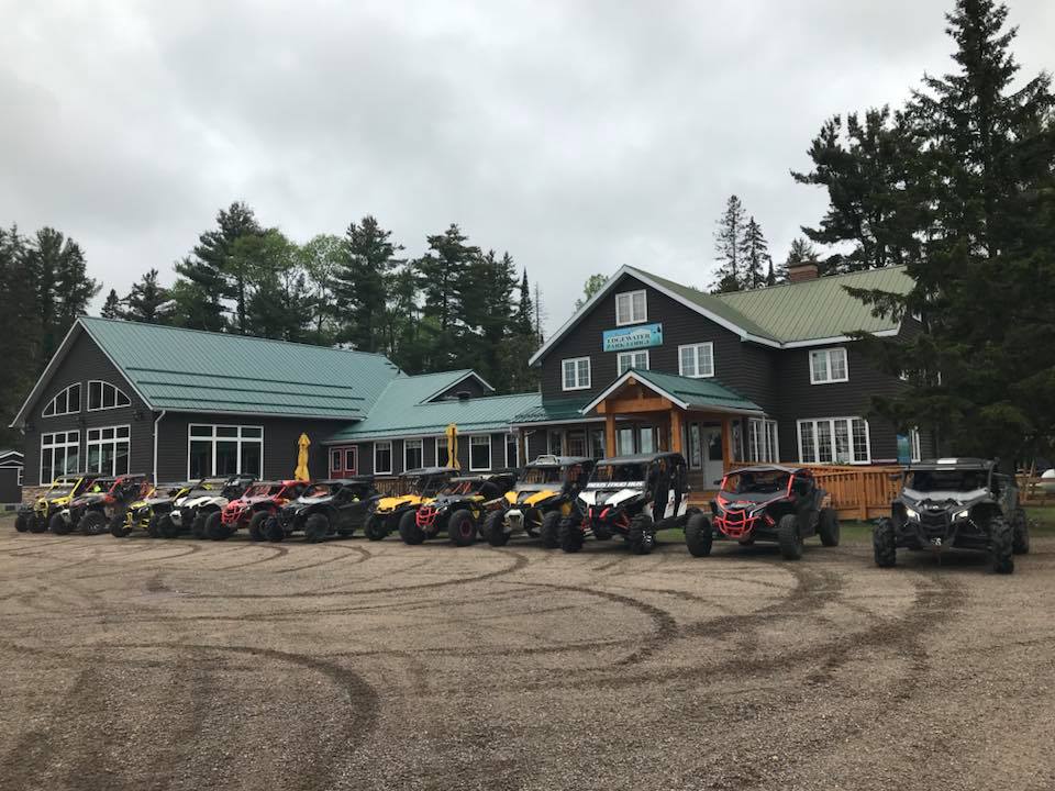 A long line of ATVs parked in front of the Edgewater Park Lodge.