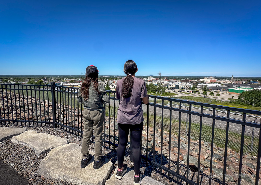 Kids looking at open pit