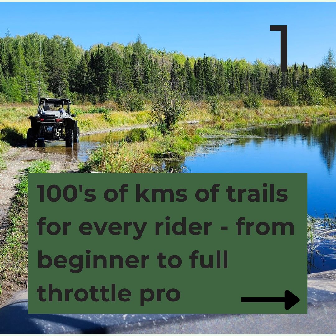 an atv drives along the edge of a shining lake surrounded by thick forest under a blue sky with the caption "100s of km of trails for every rider, from beginner to full-throttle pro".
