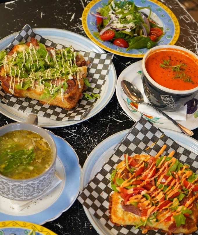 a tableful of brightly coloured soups and fresh, hearty sandwiches at Kitchen Six Seven.