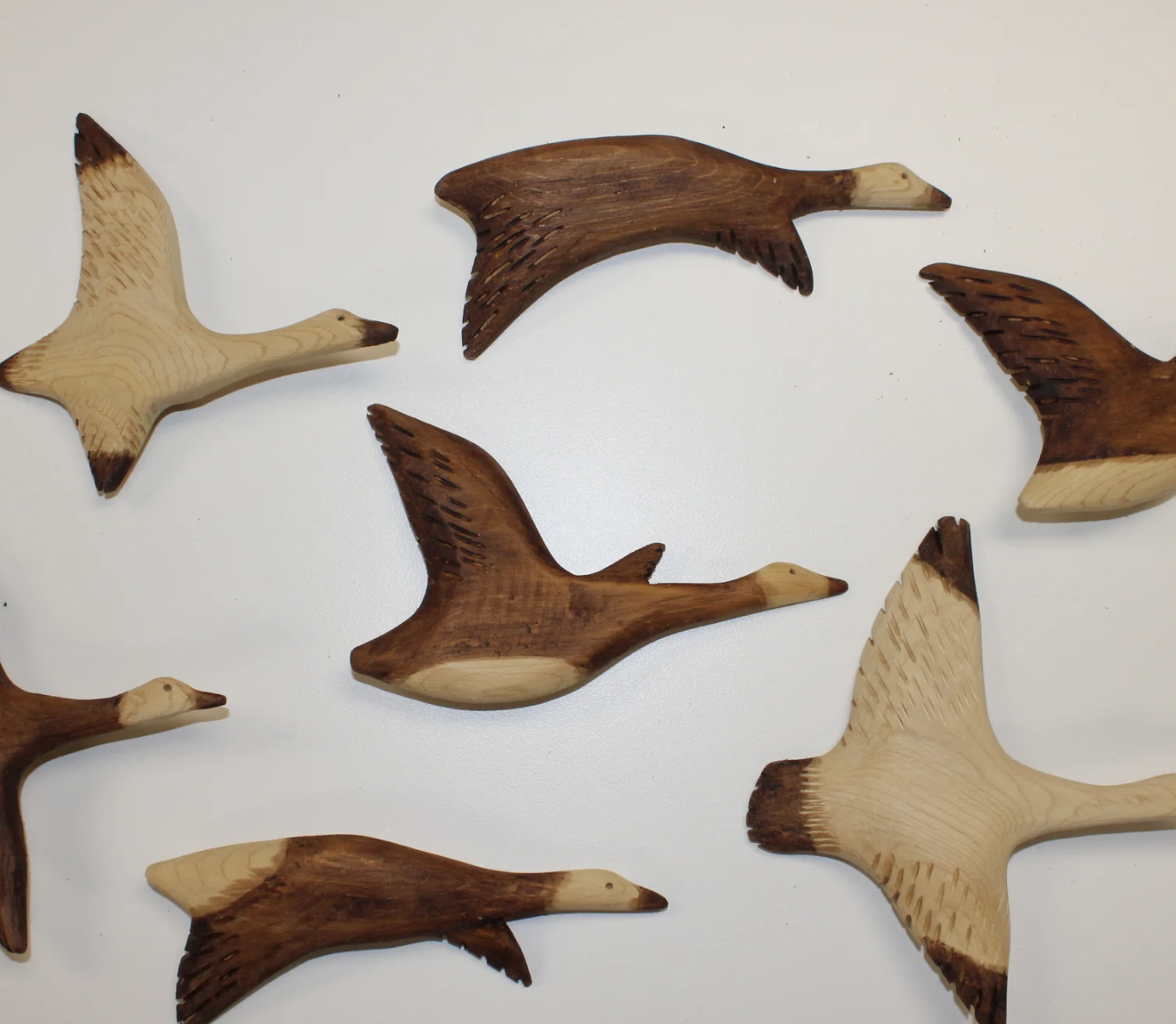 handcarved wooden snow geese by Niska Artisans in Timmins, Ontario.