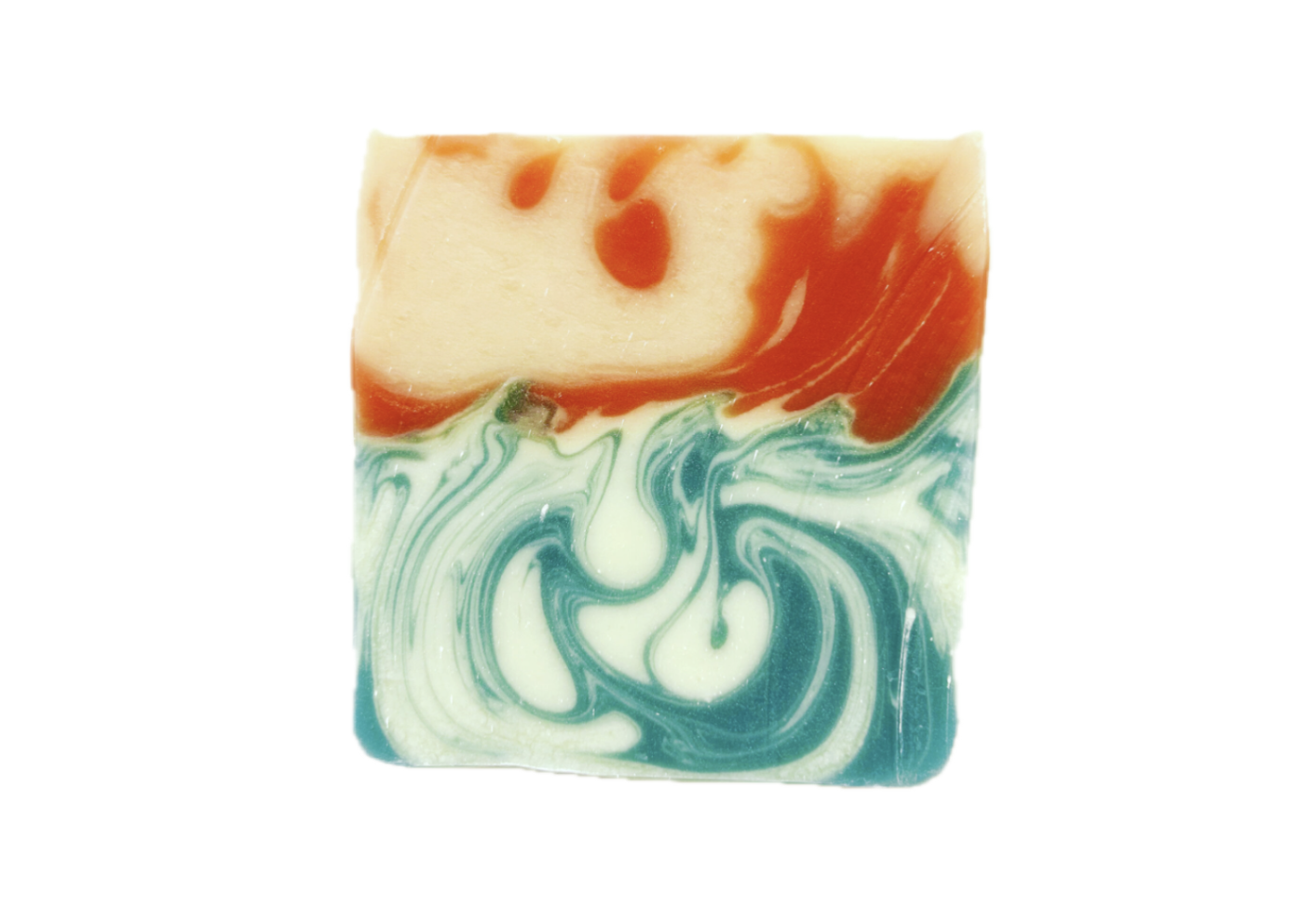 a square of soap with blue and white swirls near the bottom and orange and white across the top, resembling swirling water with a sunset above.