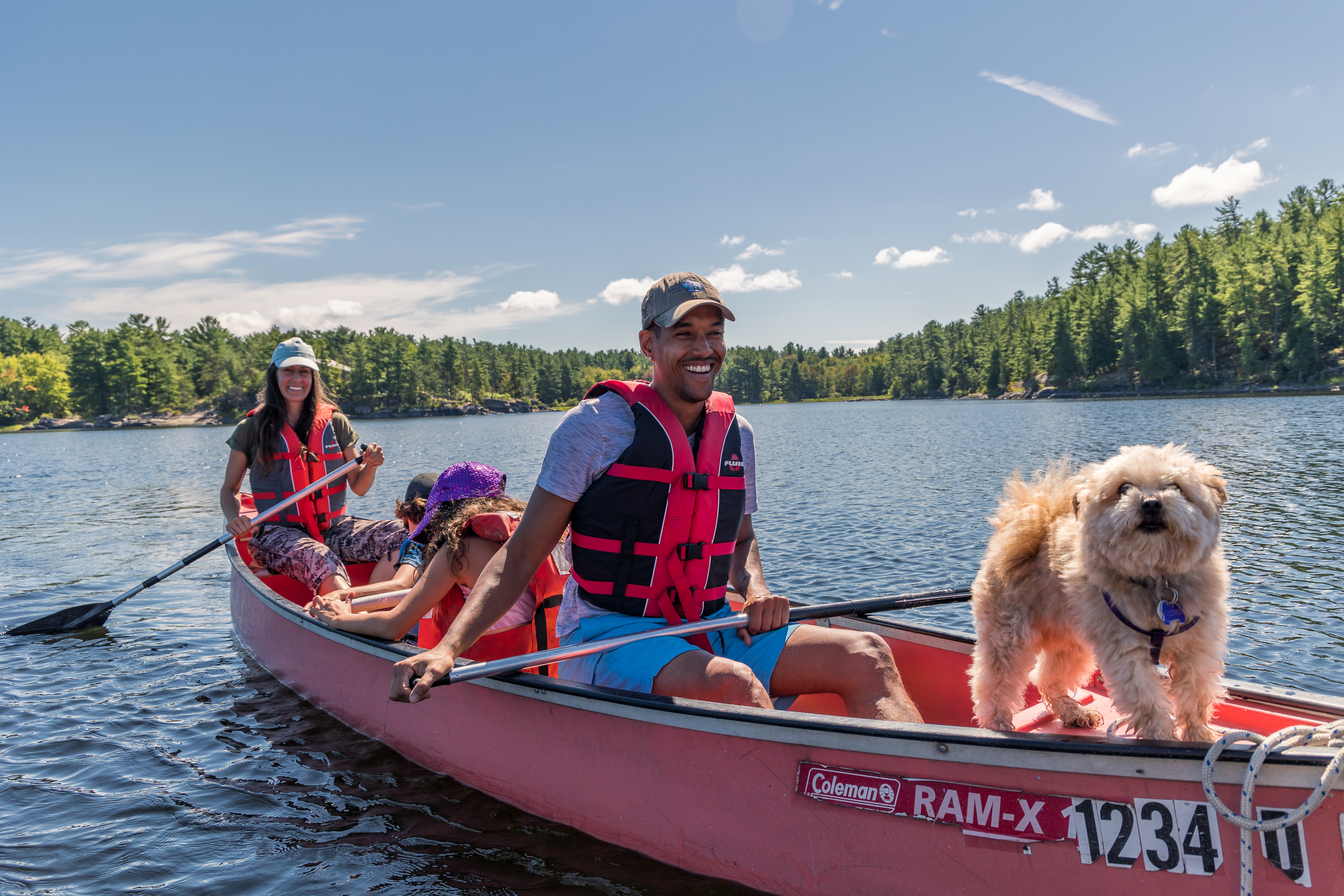 Family canoeing the French River