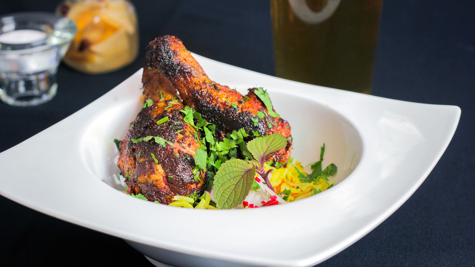 lamb chops garnished with fresh colourful herbs at Churchill's in North Bay.