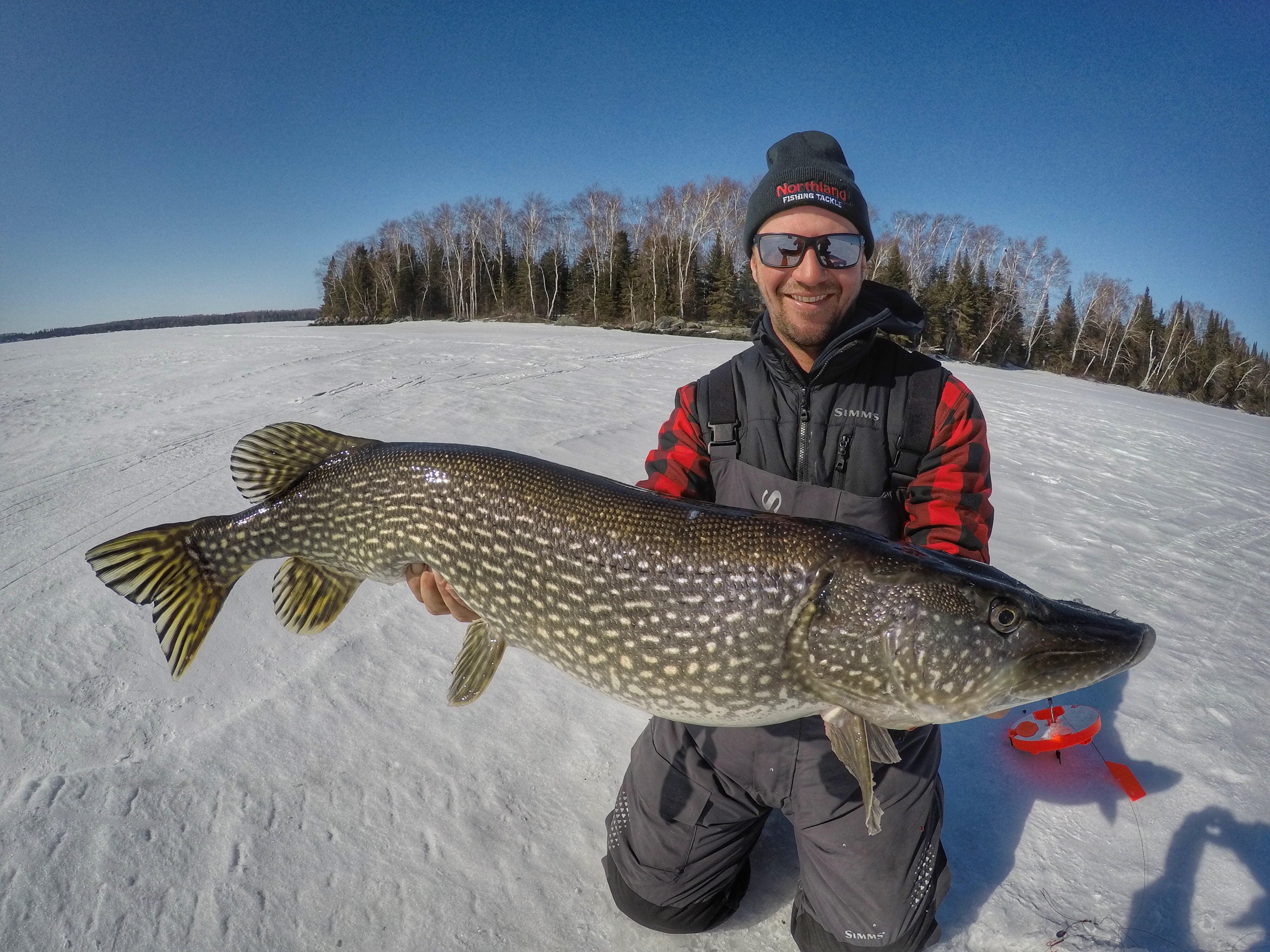 Jeff Gustafson with a Sunset Country Northern pike caught through the ice.