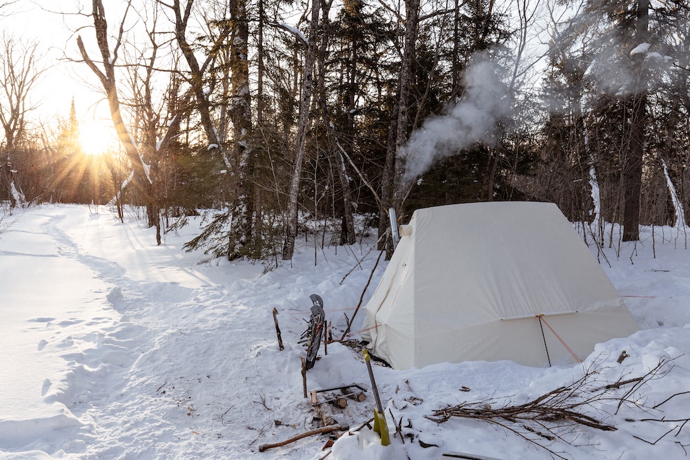 Hot tent in the woods in the winter