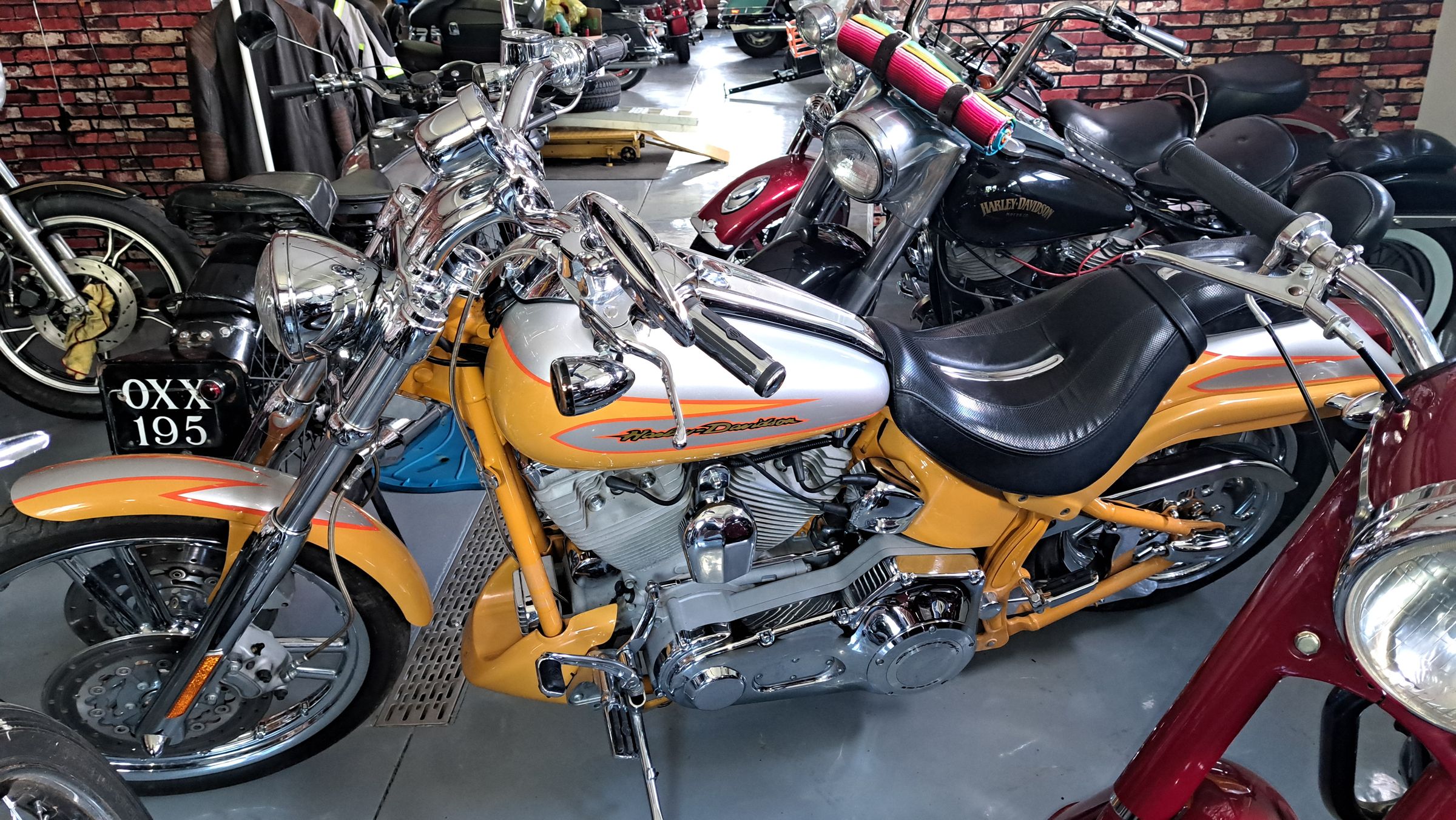 a row of shiny vintage motorcycles lined up in an indoor display at the Kisselgoff Motorcycle Museum in Thunder Bay, Ontario.