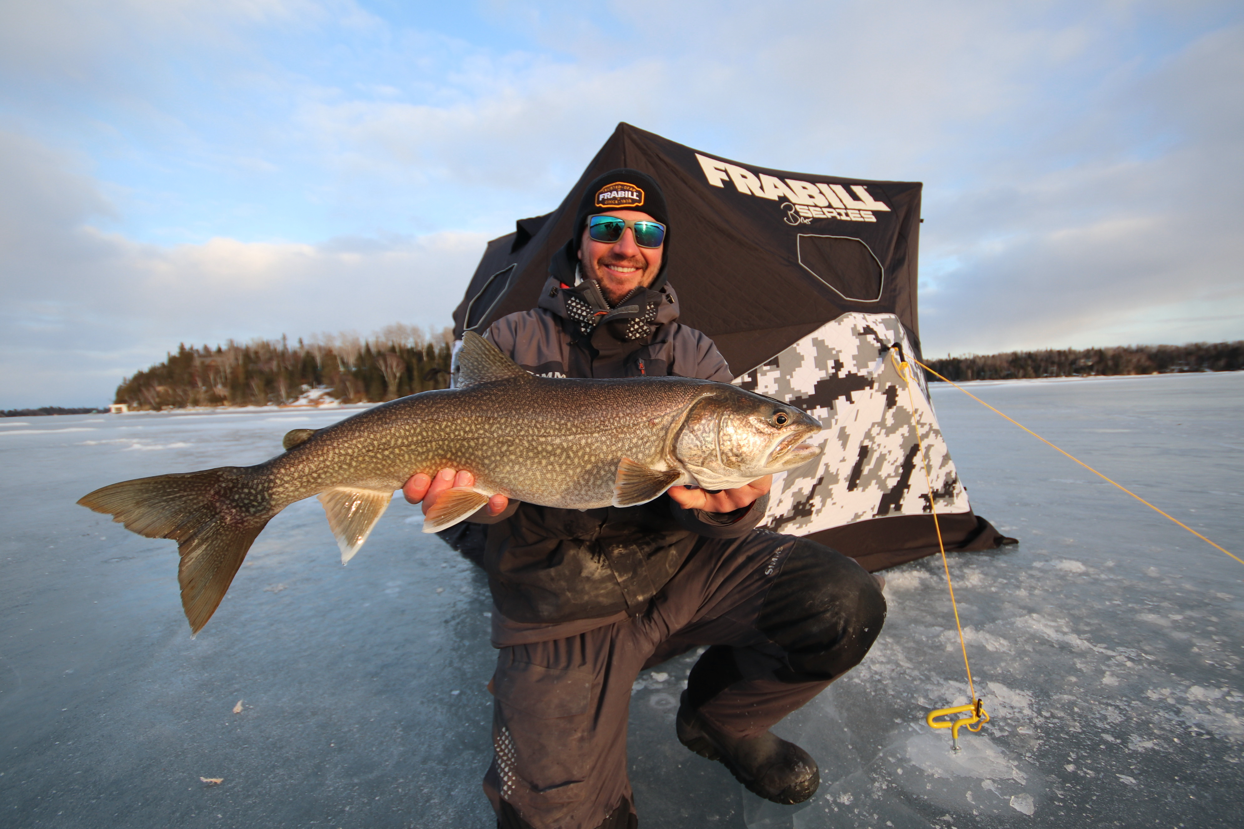 The author with a nice lake trout caught on Lake of the Woods.