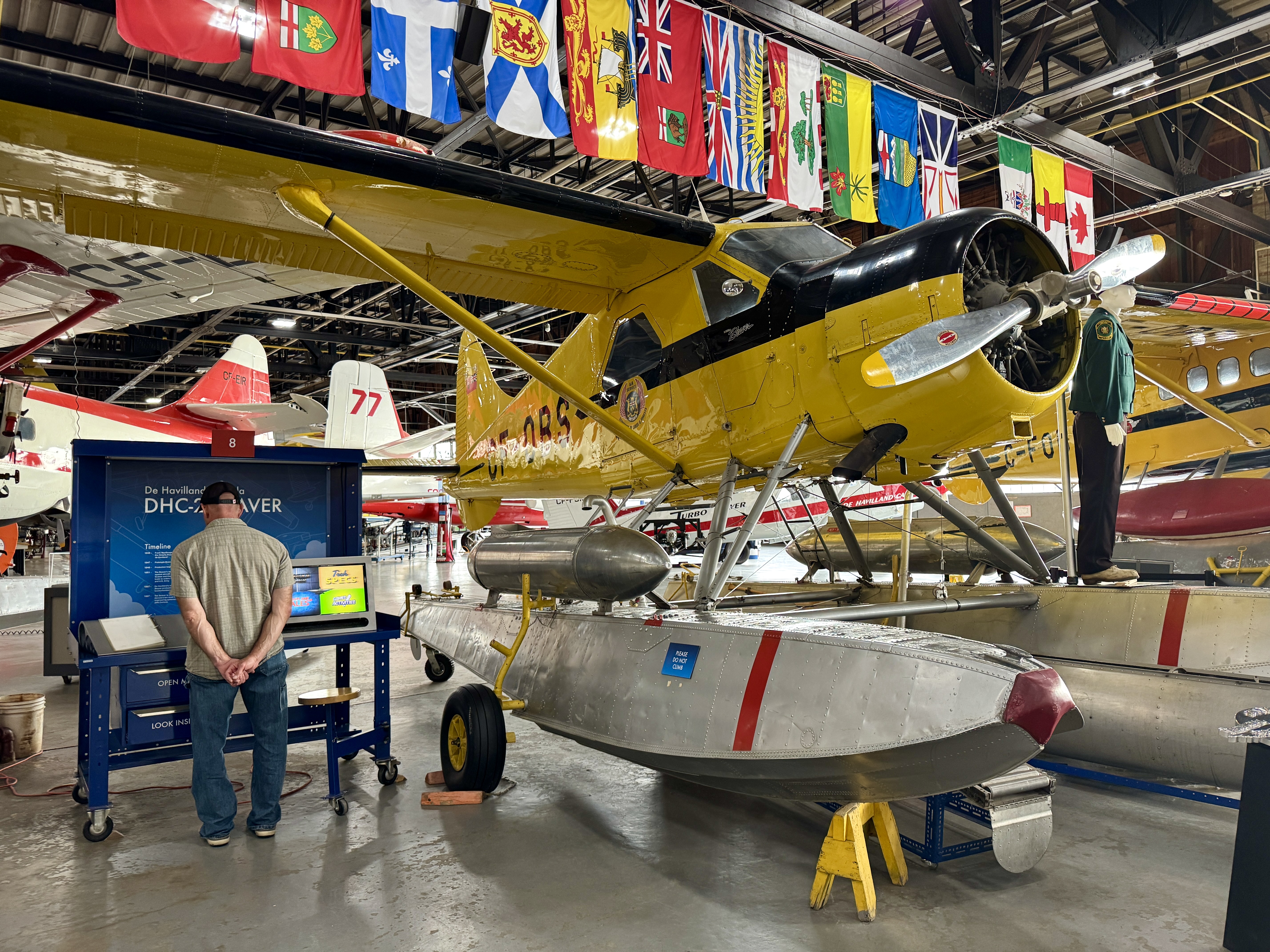 Shiny retored bushplanes at an indoor exhibit at at the Canadian Bushplane Heritage Centre in Sault Ste. Marie.