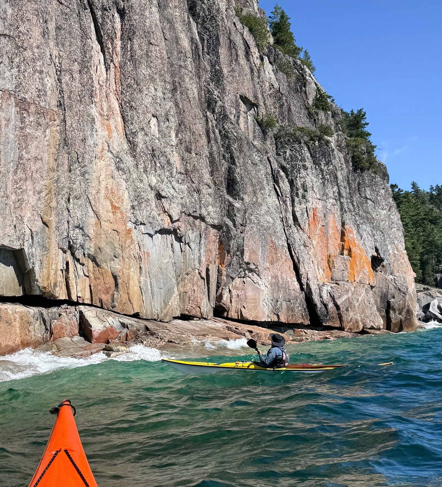 Thrive Tours Kayaking around cliff