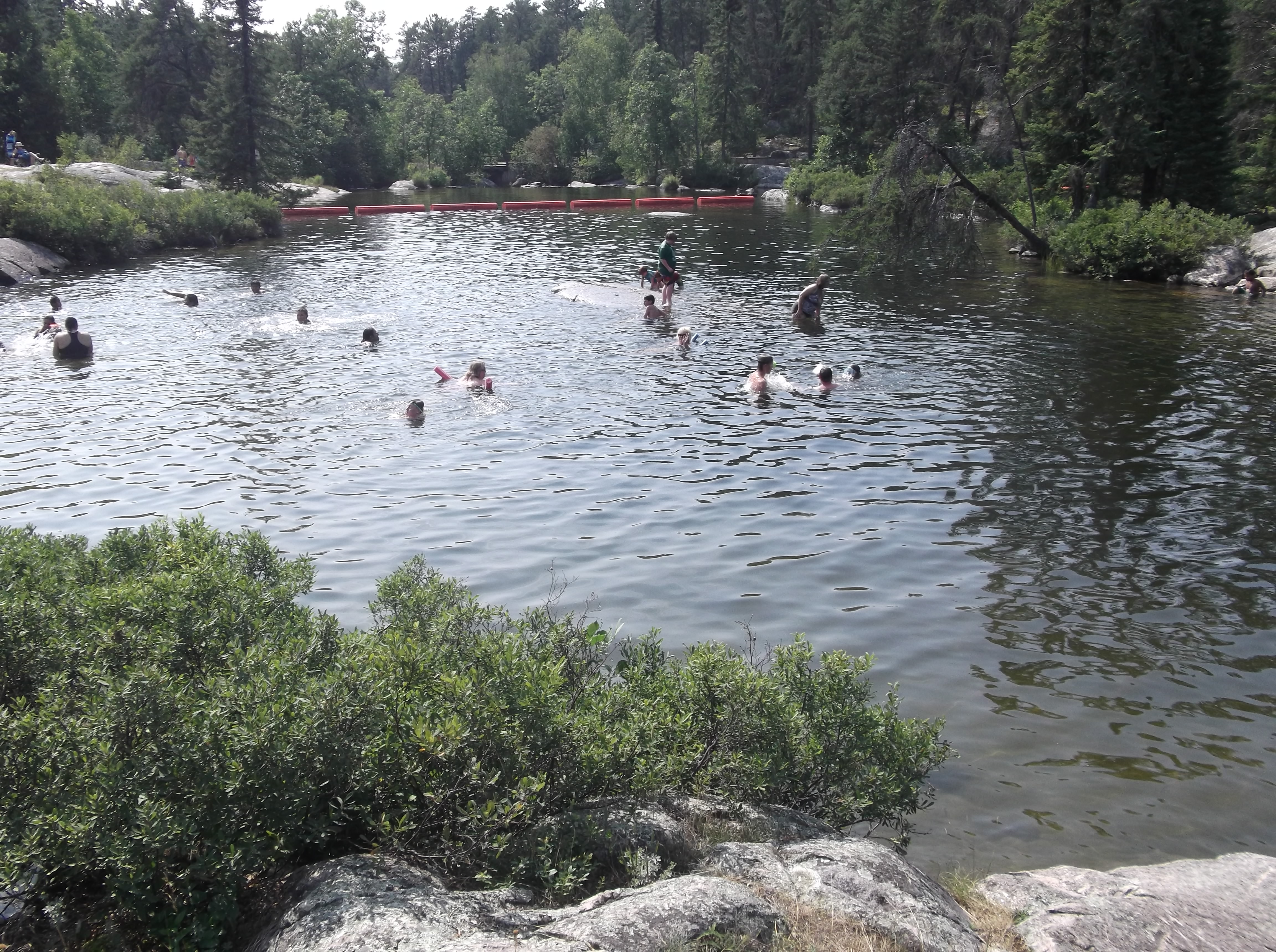Enjoy a cool dip at the beach in Rushing River Provincial Park.