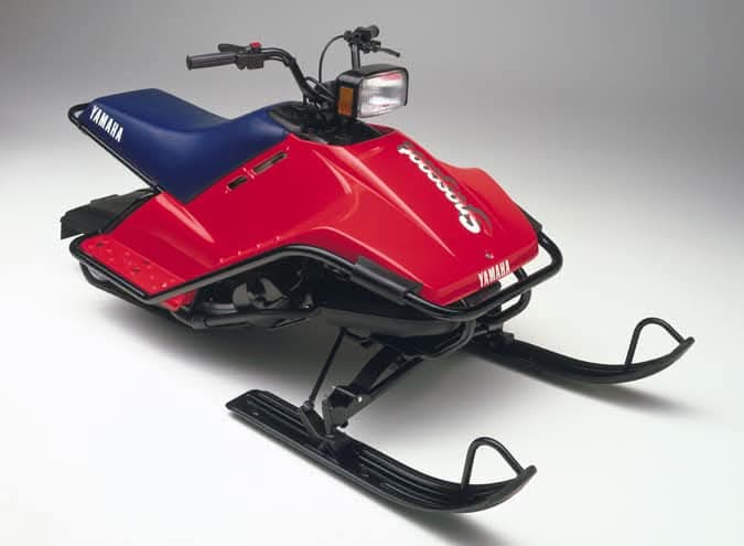 a short, red 1988 Yamaha SnoScoot, built for smaller riders. 