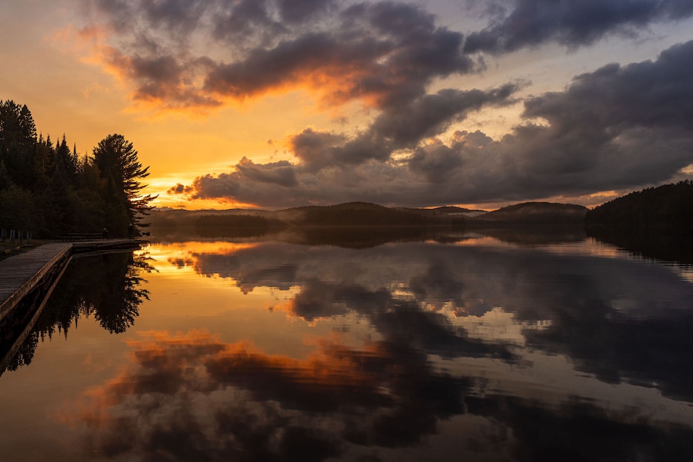 Sunrise over a glassy lake