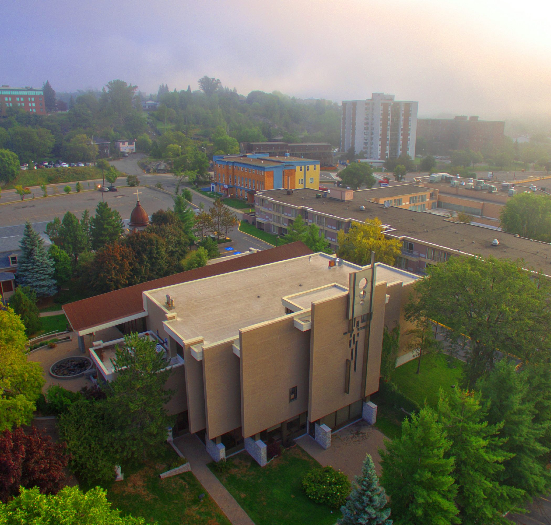 The Paroisse Ste-Anne-des-Pins in Sudbury, Ontario, a striking modern, geometric brick design with a glass-walled entrance hall.