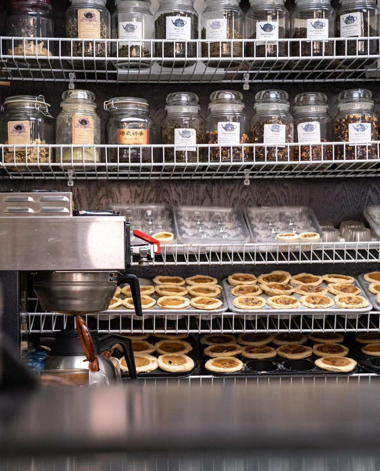 Trays of butter tarts and rows of jars filled with loose leaf tea stock the shelves at Tea & Bloom.