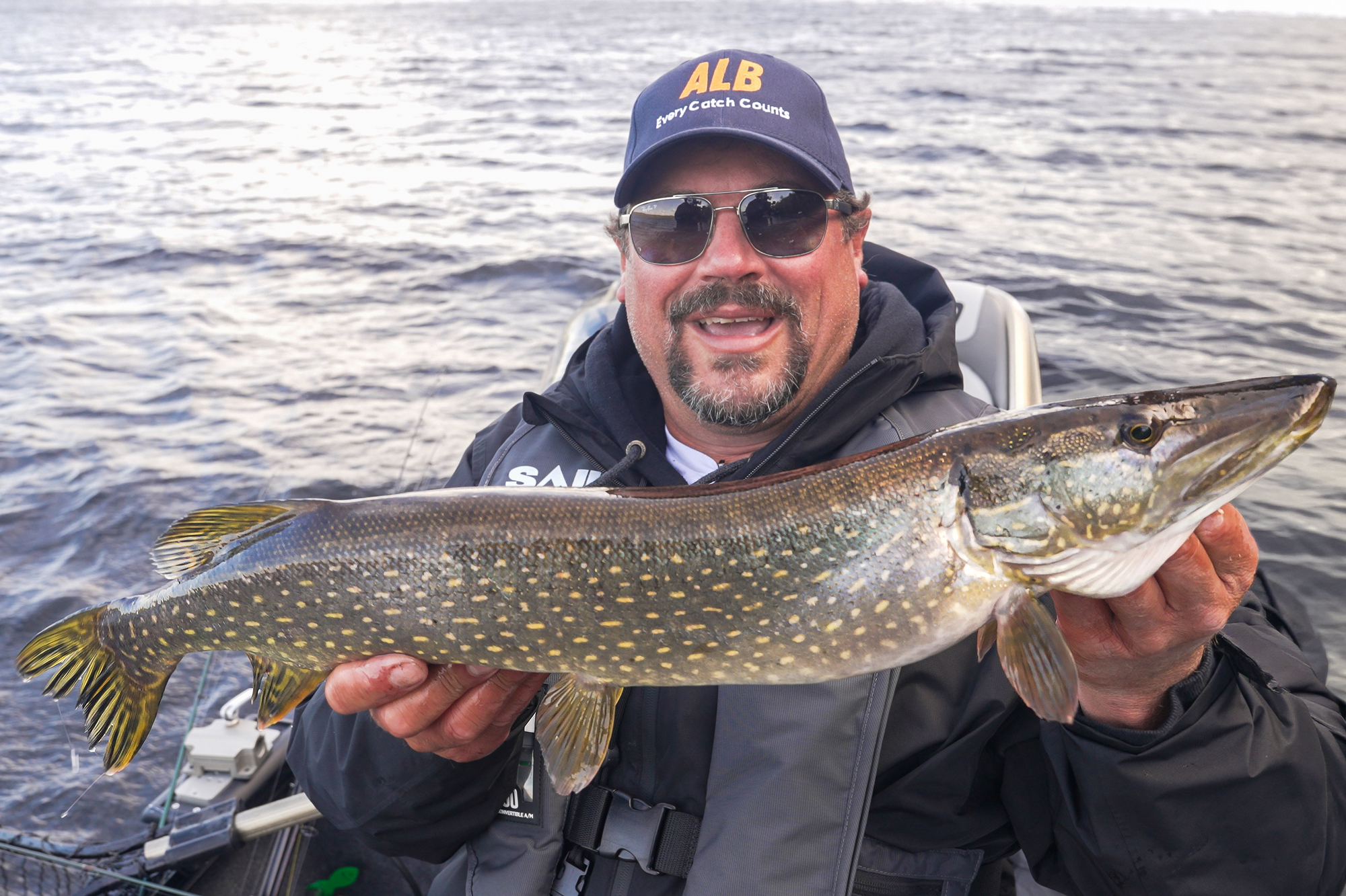 angler fishing northern pike
