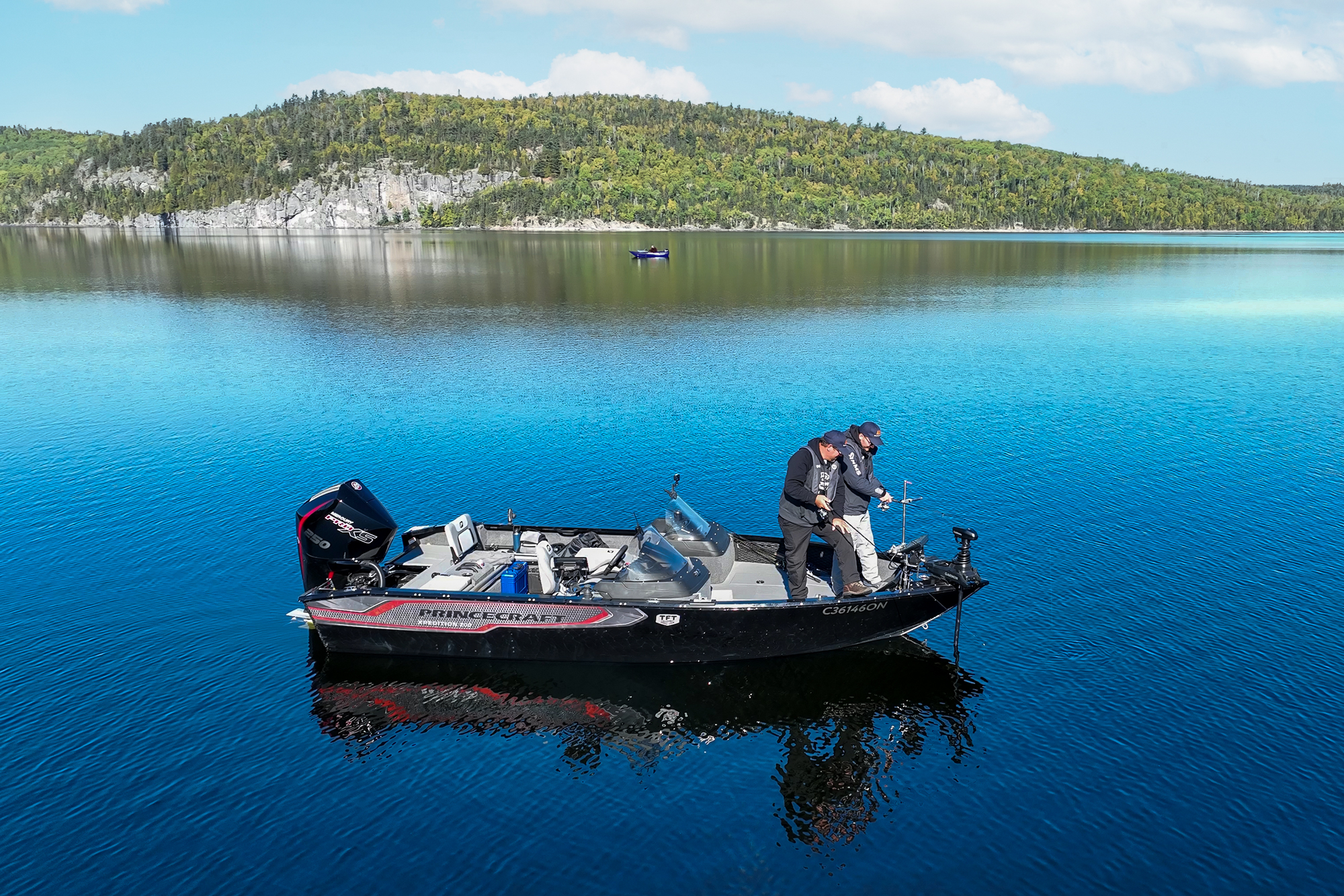 2 boats on a lake fishing