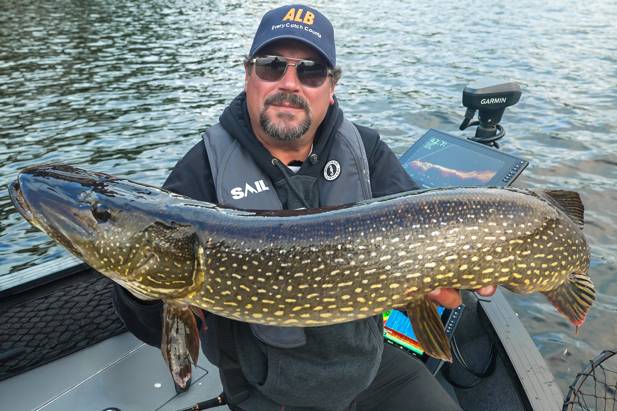 angler fishing northern pike