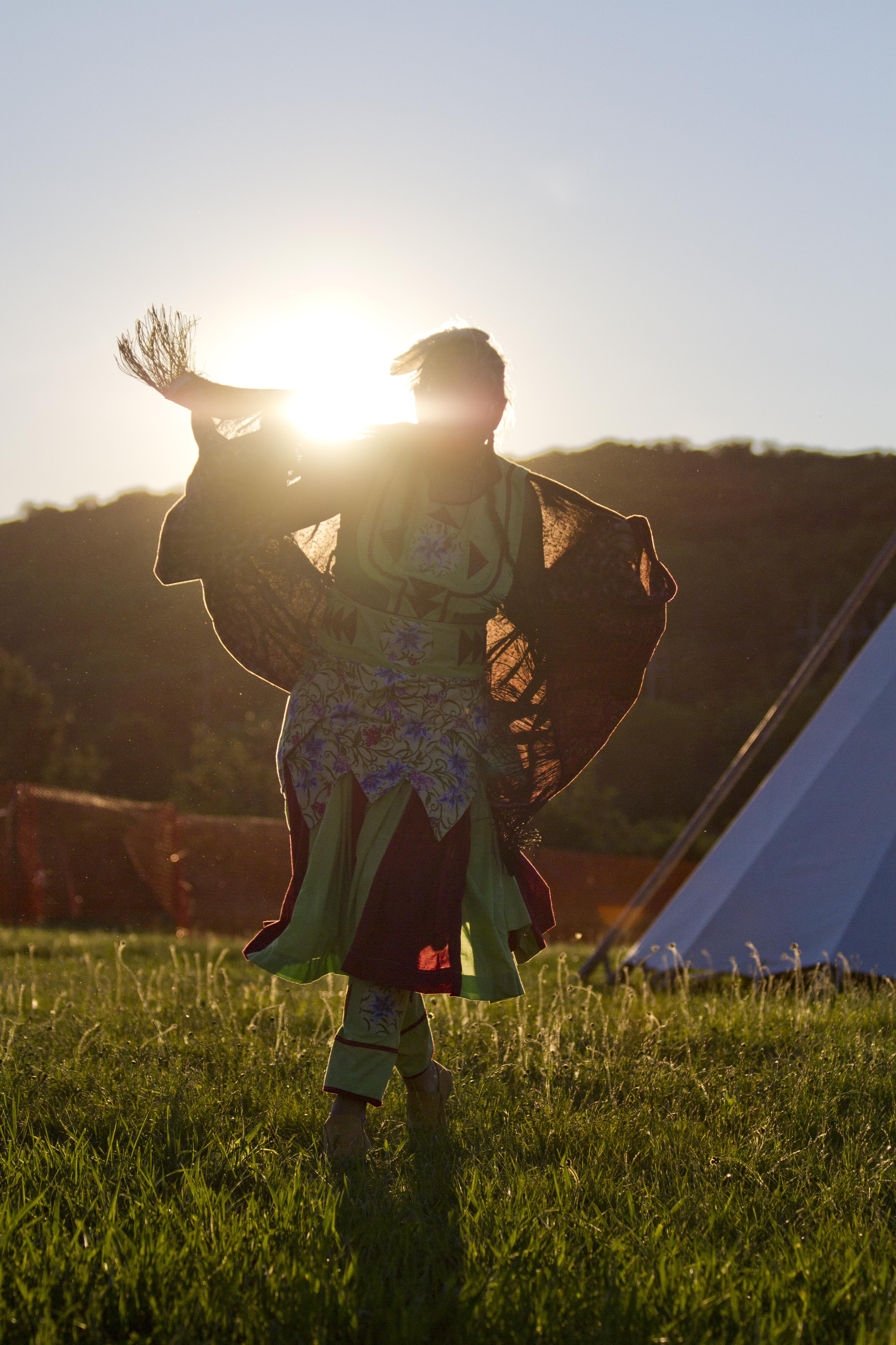 Dancer at a Powwow against the sunset