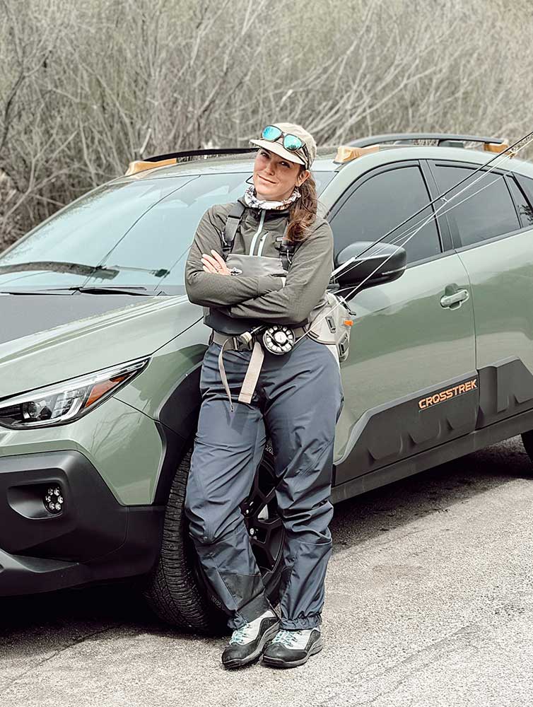 person standing beside a car