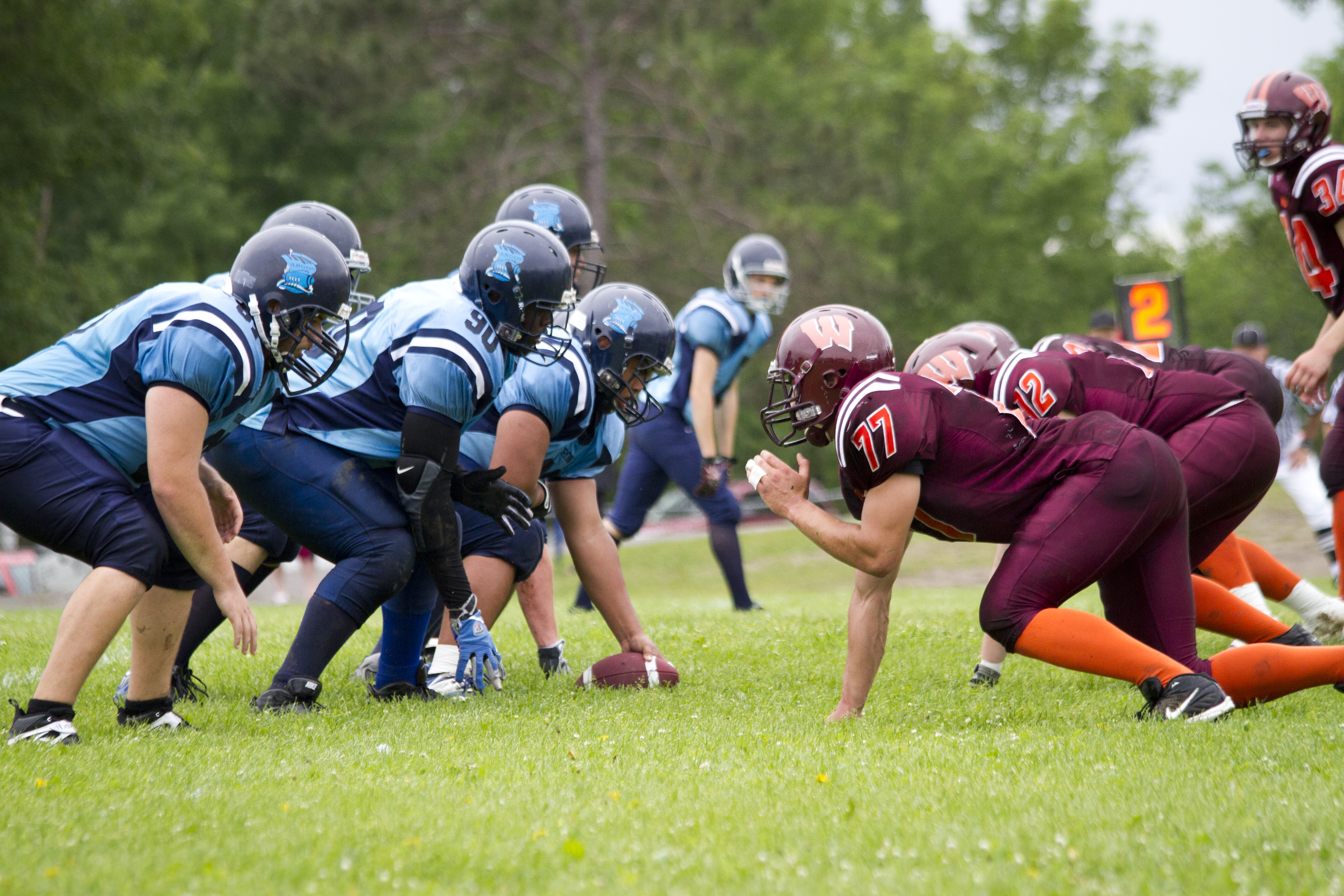 two opposing football teams kick off at an outdoor game in North Bay.