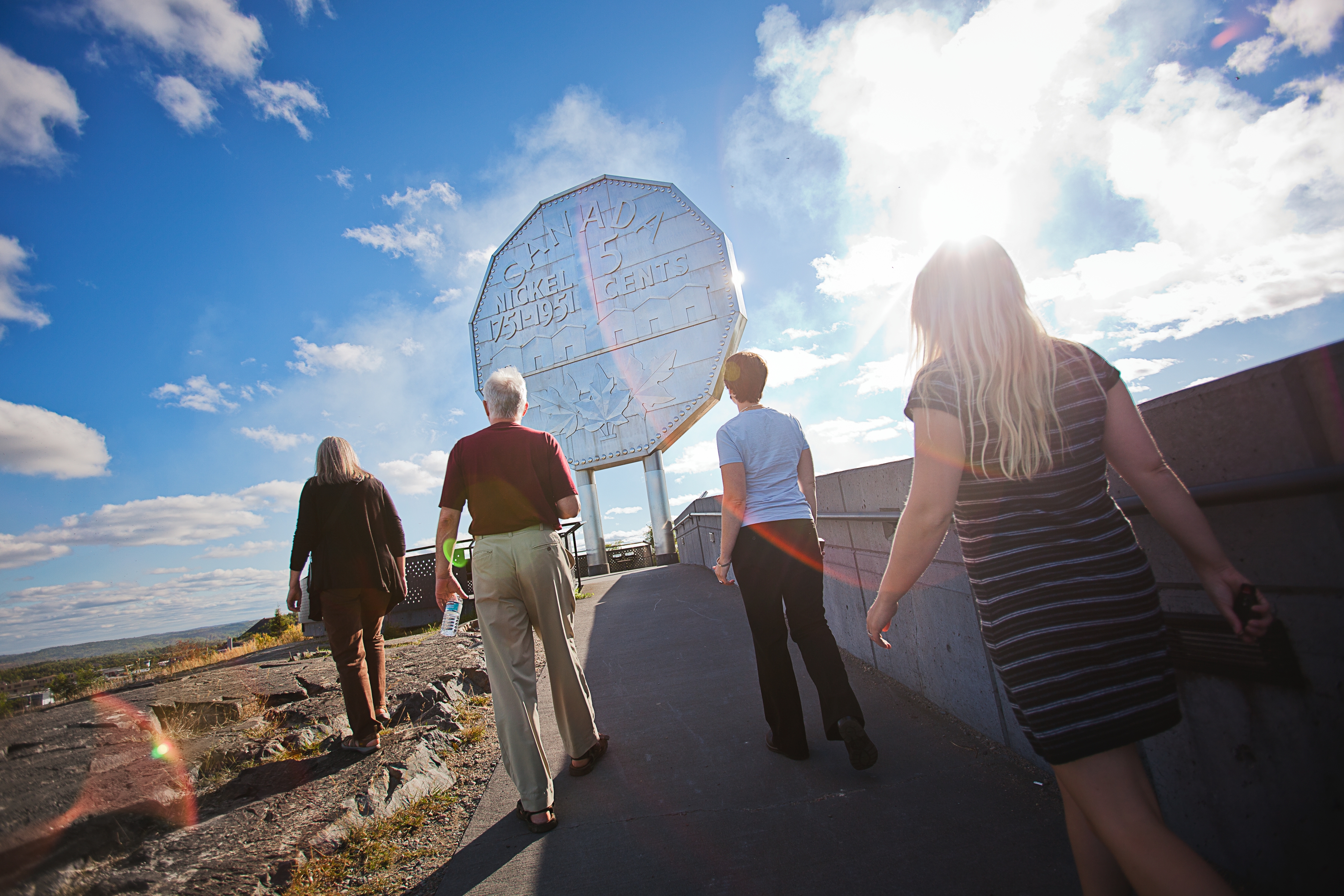 4 people walking to the famous Sudbury Nickel