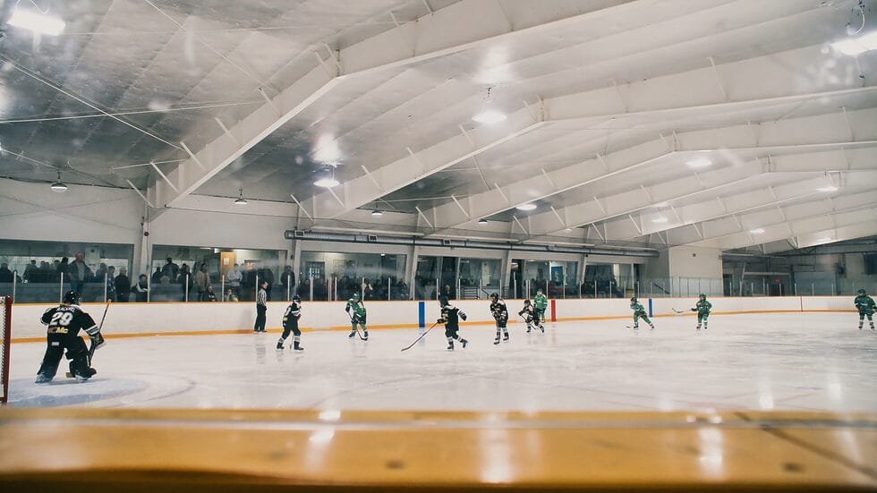 Pete Palangio rink, a large hockey area with a team practicing on the ice.