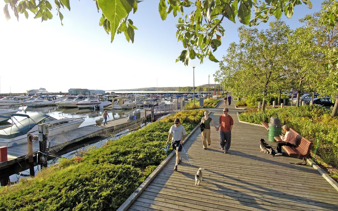 People walking on the waterfront boardwalk