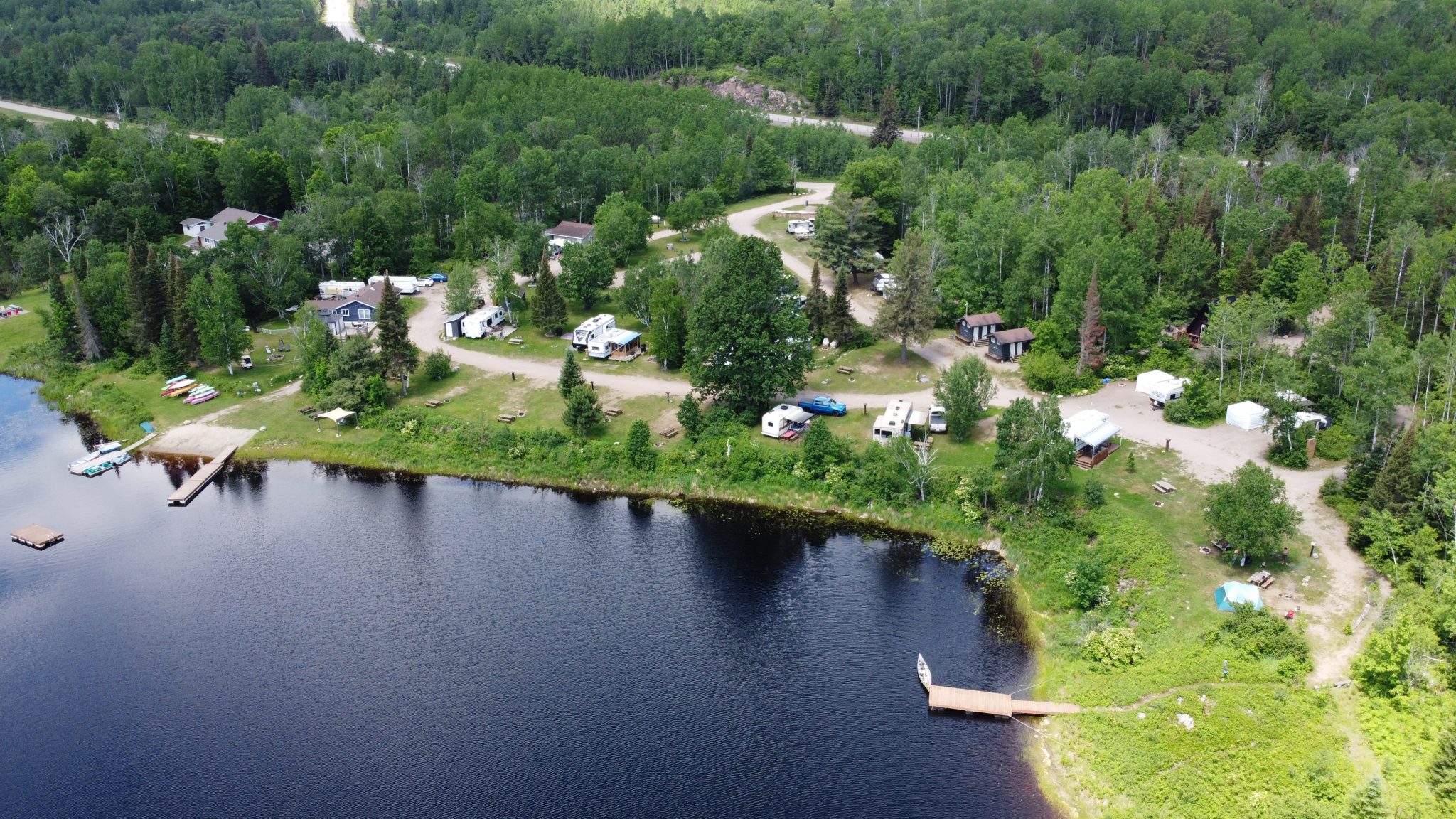 Spanish River Resort and Campground, with docks and campsites dotting the lush green forested shores.