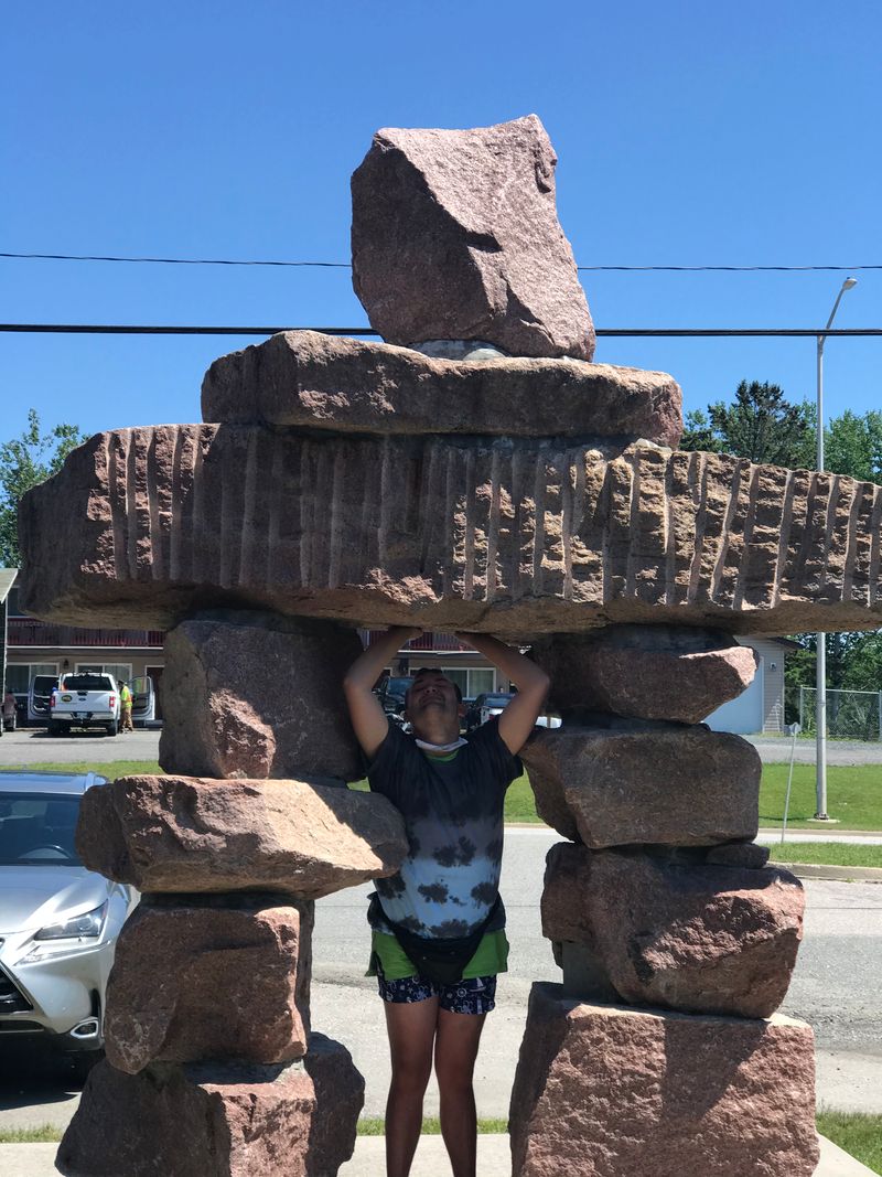 Pose with the Inukshuk in Sioux Narrows.