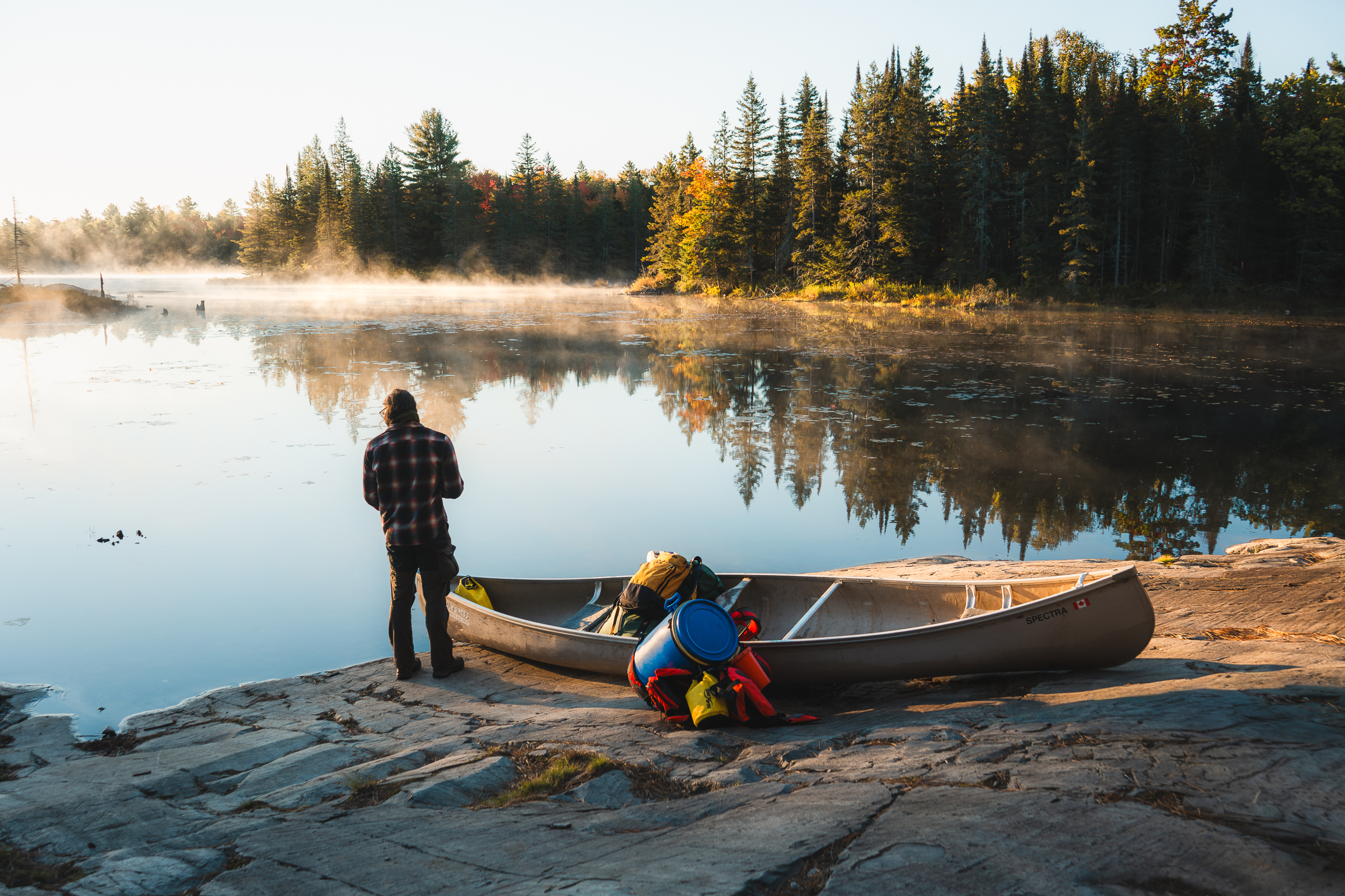Early morning portage into David Lake in Killarney Provincial Park