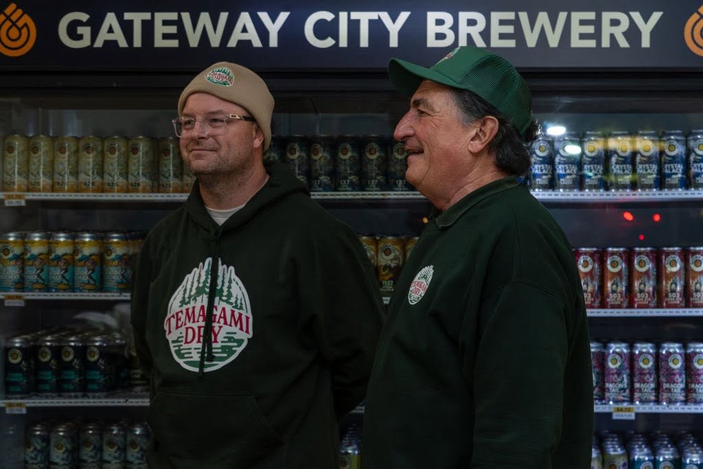 The mayor of Temagami laughs and smiles at the Temagami Dry product launch at Gateway City Brewery. 