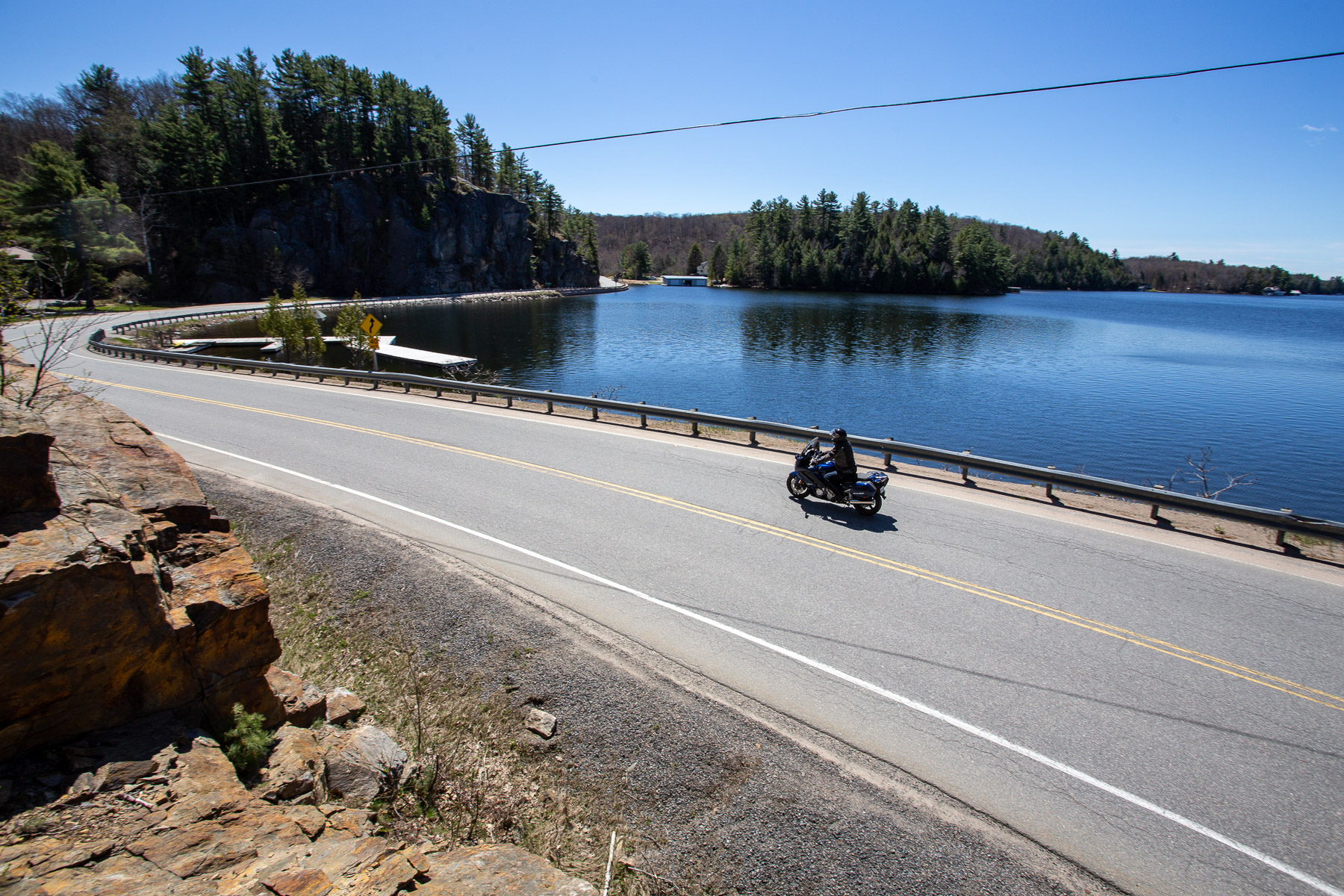 Motorcycle rider by the lakeside