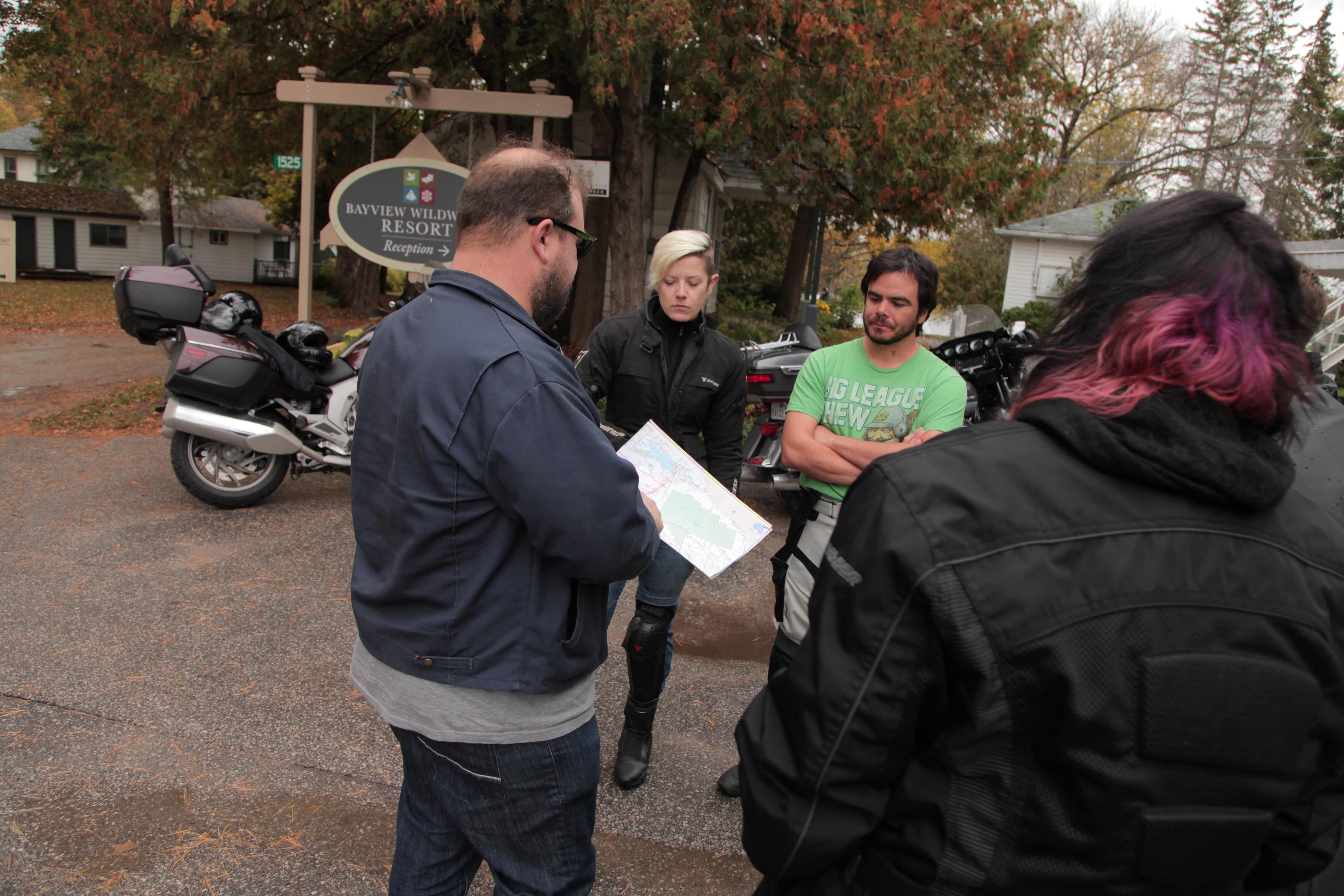 a group of riders planning a motorcycle trip in fall