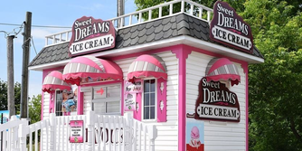 Sweet Dreams Ice Cream at Marina Del Rey, a small, tidy white wooden building with bubblegum pink gables.
