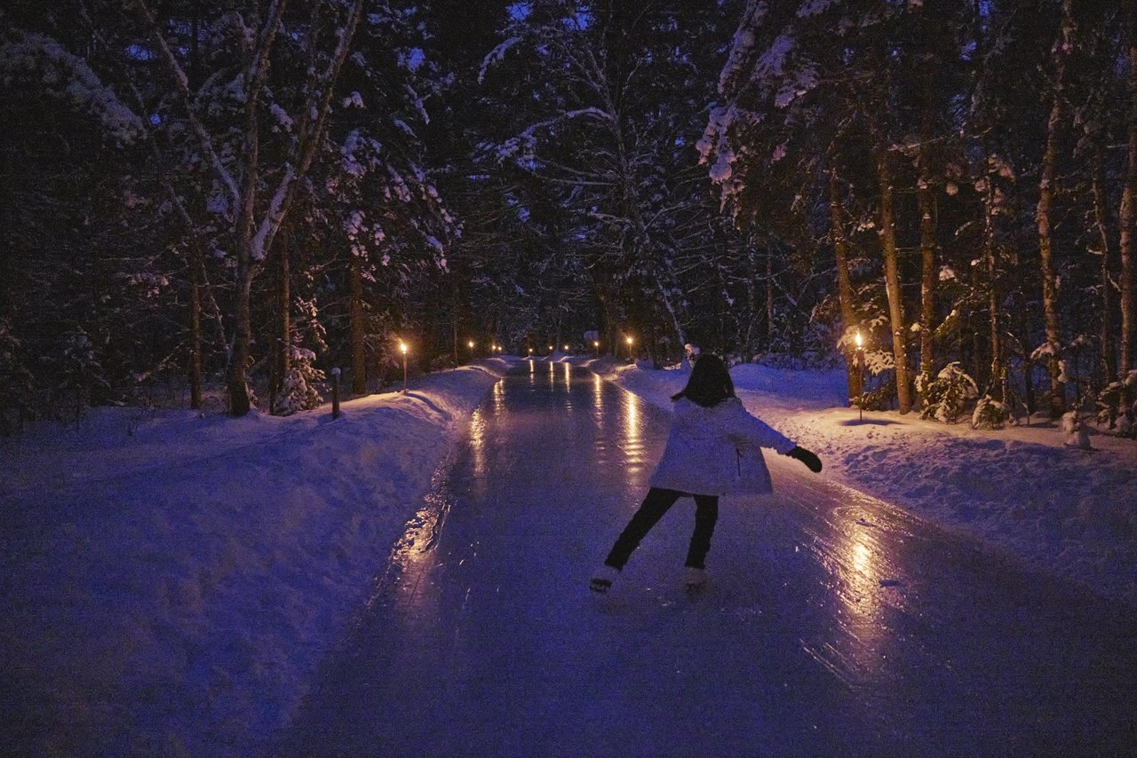 woman on skating trail at night
