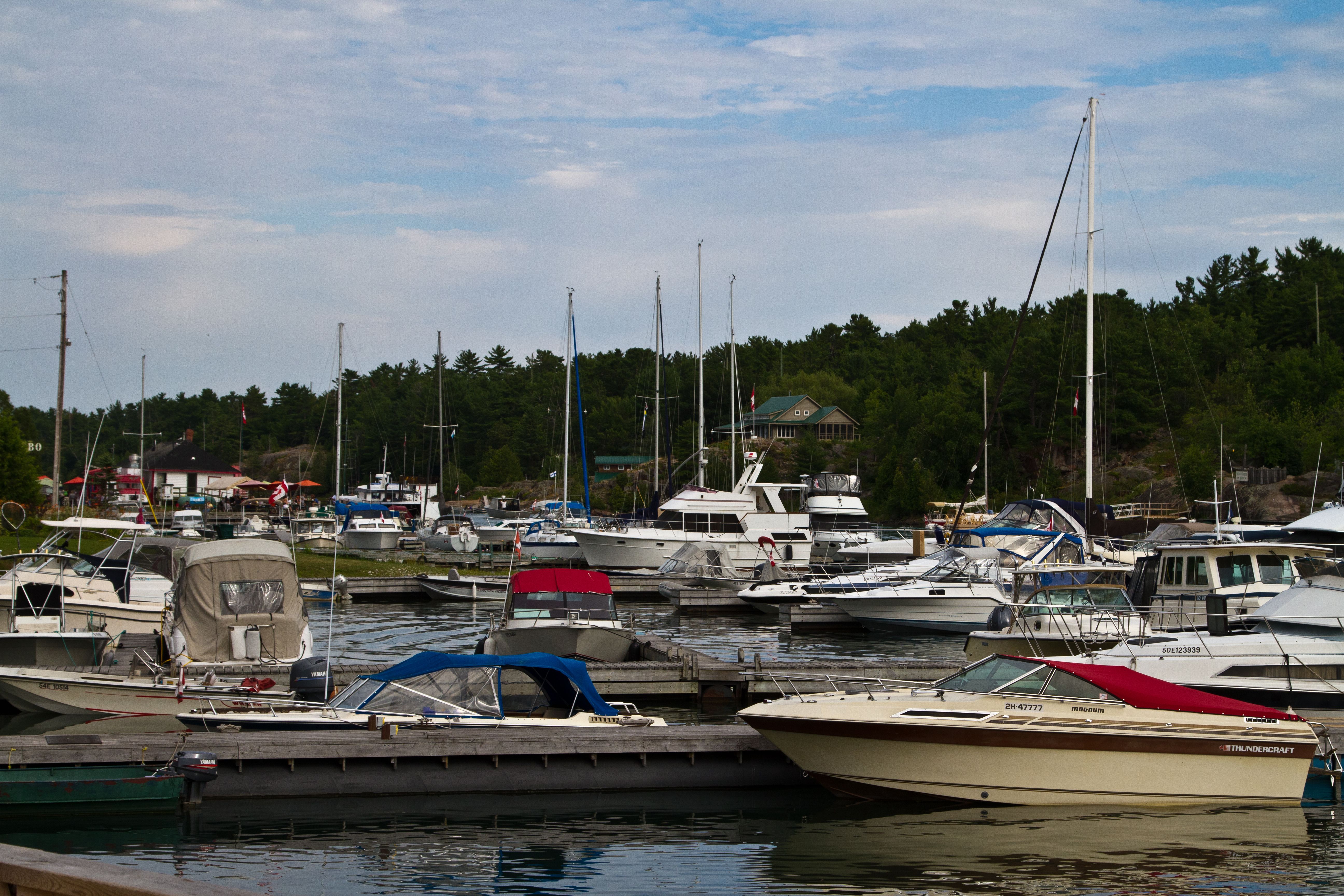 rows of boats in the slips at the Little Current Marina on a summer day. 