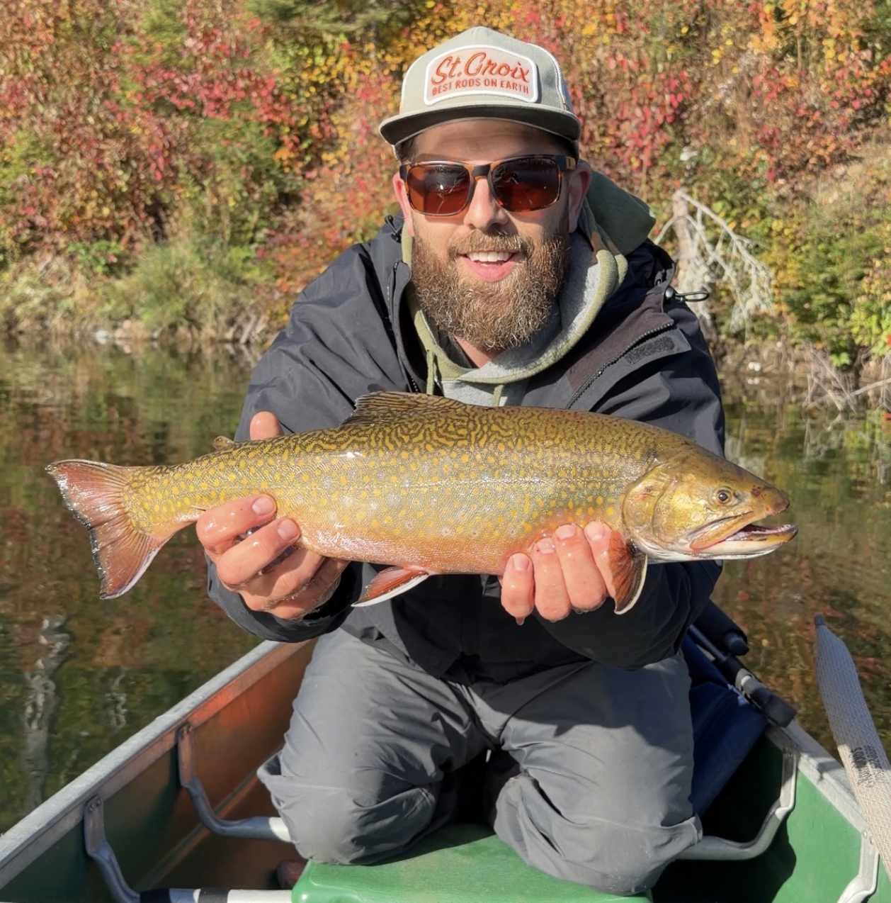 Len holding his 20" aurora trout in October 2026