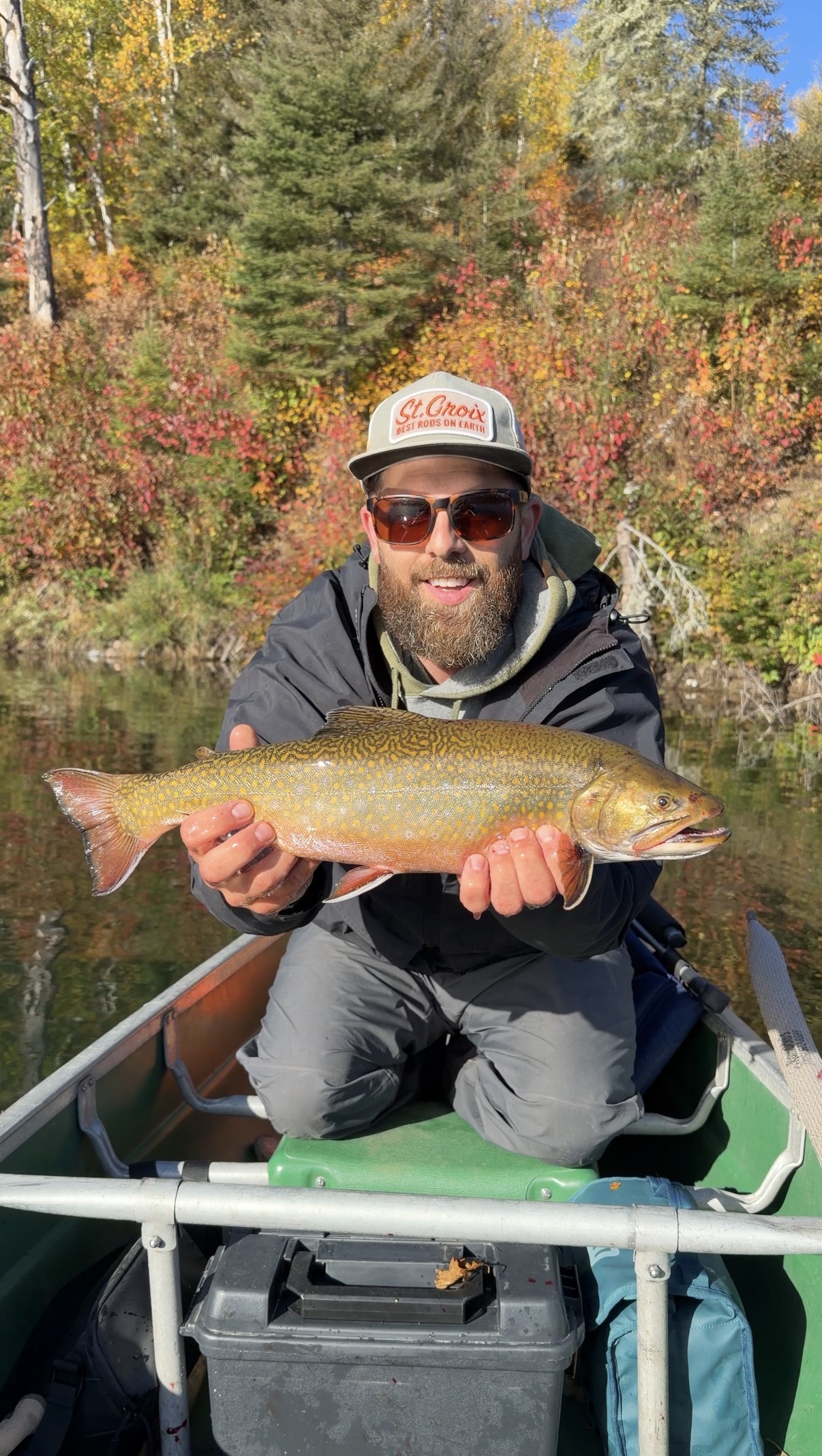 Len holding an aurora trout