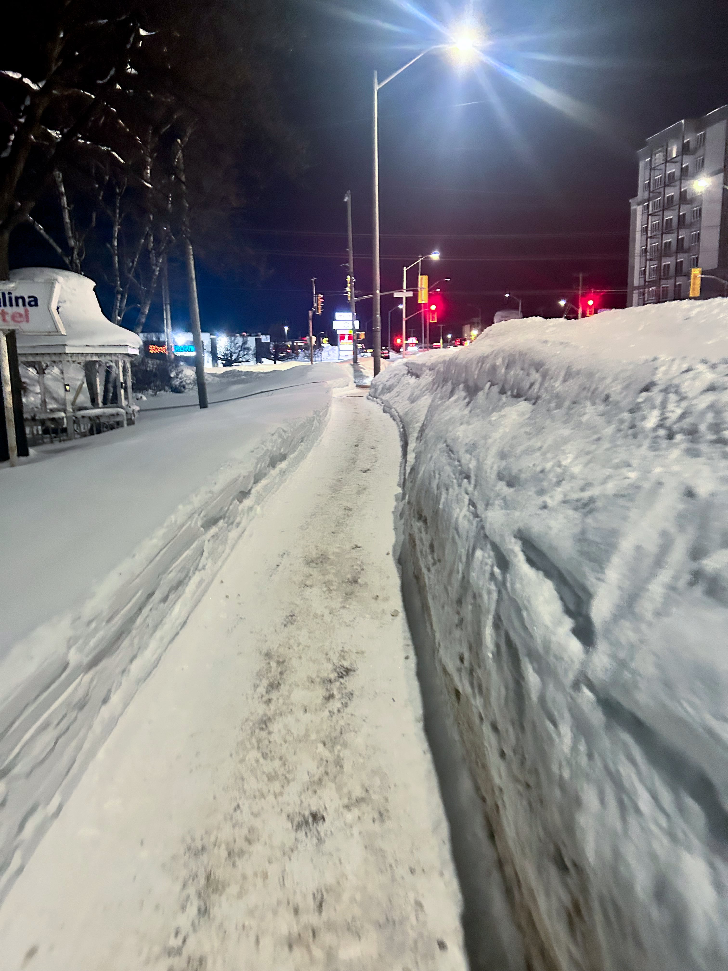 Sault Ste. Marie Ontario sidewalk cleared of deep snow