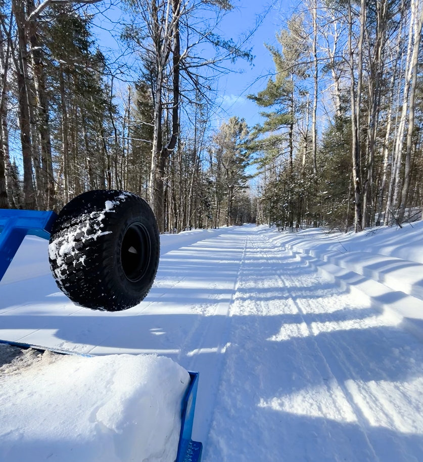 view of snowmobile trails from groomer
