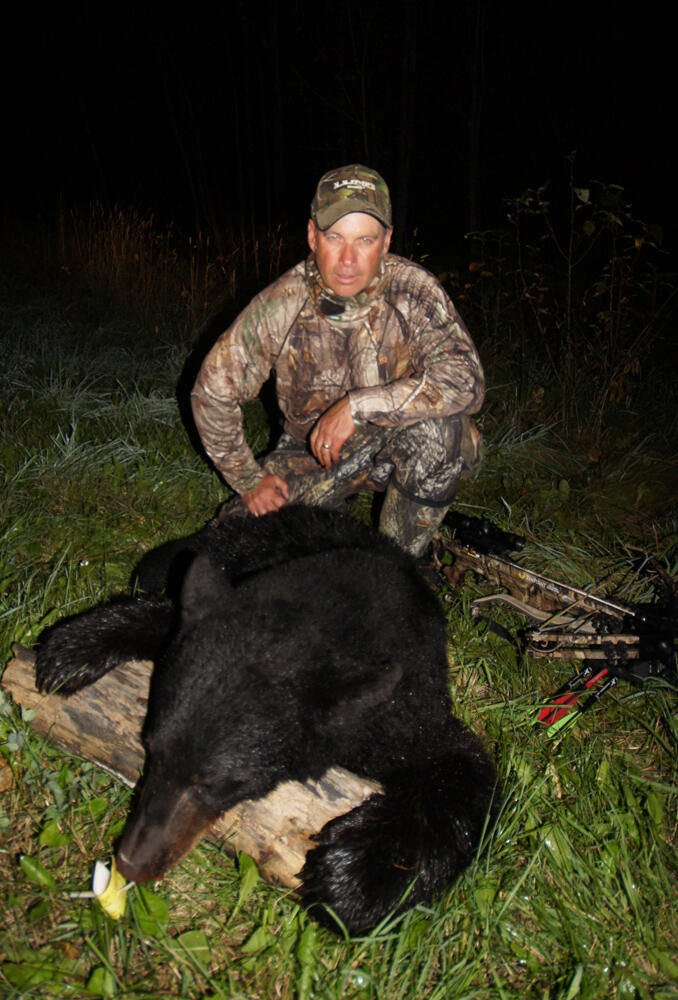 Gord Ellis with a bear harvested during the Fall of 2013 in Northern Ontario