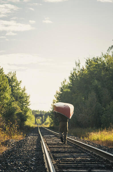 9-Portaging-canoe-on-train-tracks-